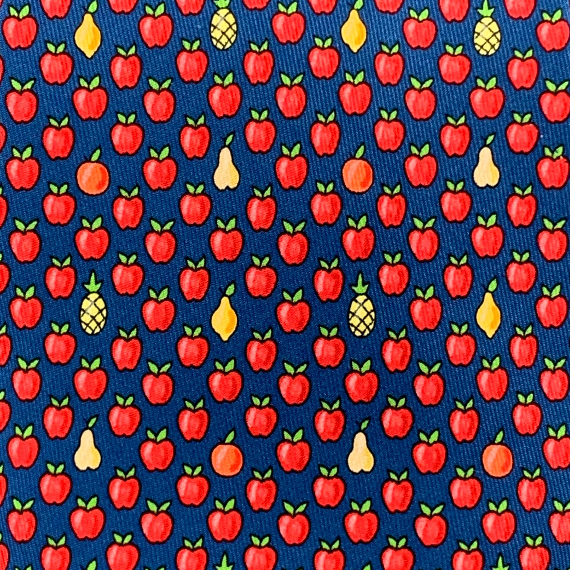 HERMES necktie comes in blue silk twill with all over apples, pears, pineapple, and orange print. Made in France.

Excellent Pre-Owned Condition.

Width: 3.75 in.