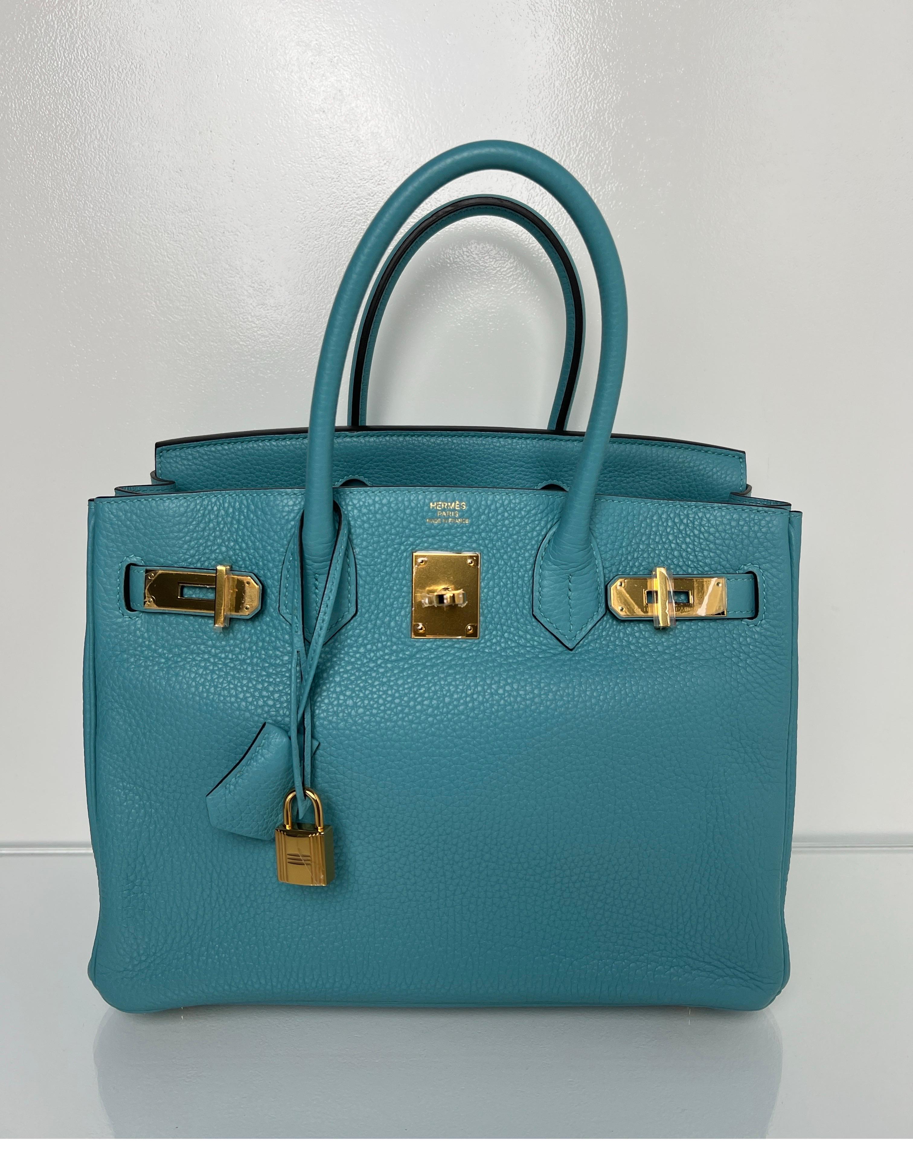 Hermes Blue Atoll Birkin 30 Bag. Beautiful blue color and rare combination. Gold hardware with togo leather. Interior clean. Size 30 is also sought after. Includes clochette, lock, keys, and dust bag. Guaranteed authentic. 