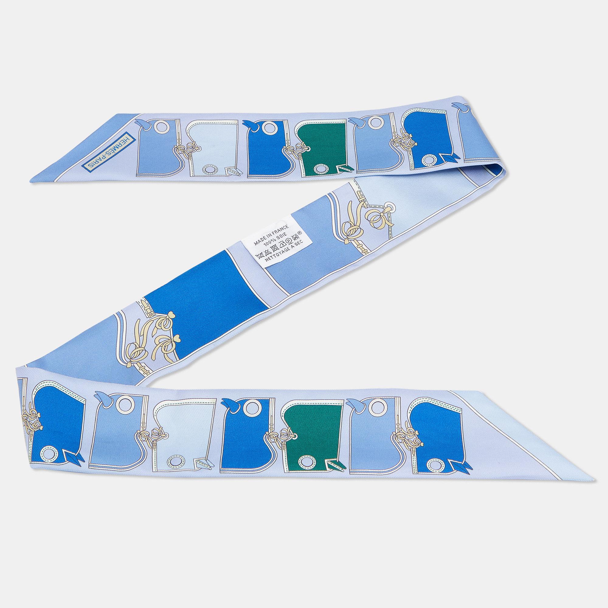This fabulous twilly by Hermès complements almost all your outfits and looks pretty whether you tie it around your hair or your wrist. Cut from silk, this scarf is adorned all over with an interesting Camails print.

Includes: Brand Dustbag
