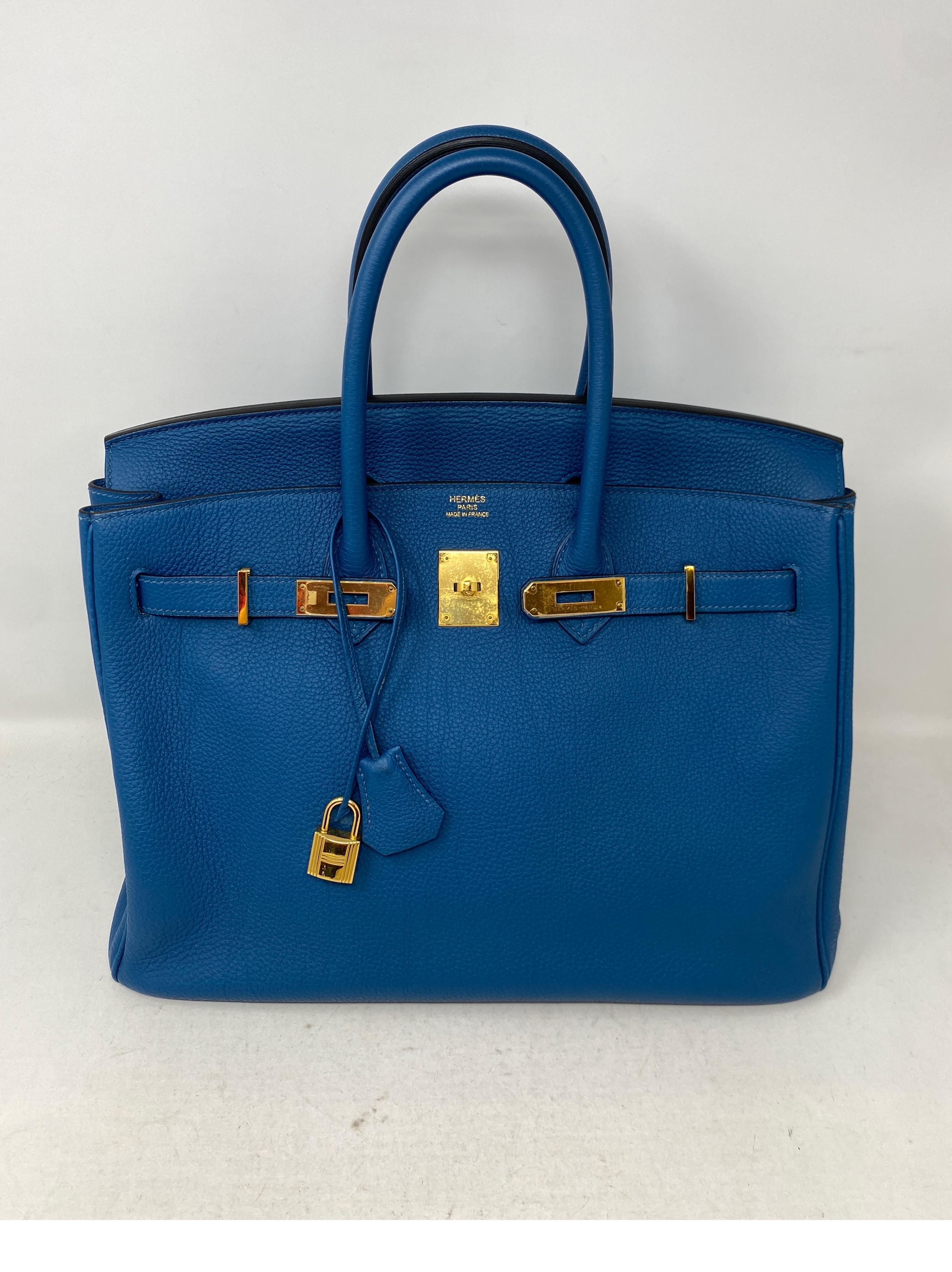 Hermes Blue Colvert Birkin 35 Bag. Gold hardware. Gorgeous vibrant blue Birkin. Excellent condition. Looks like new. Togo leather. Interior clean. Bag was never used. IGreat investment bag. Includes clochette, lock, keys, and dust bag. Guaranteed