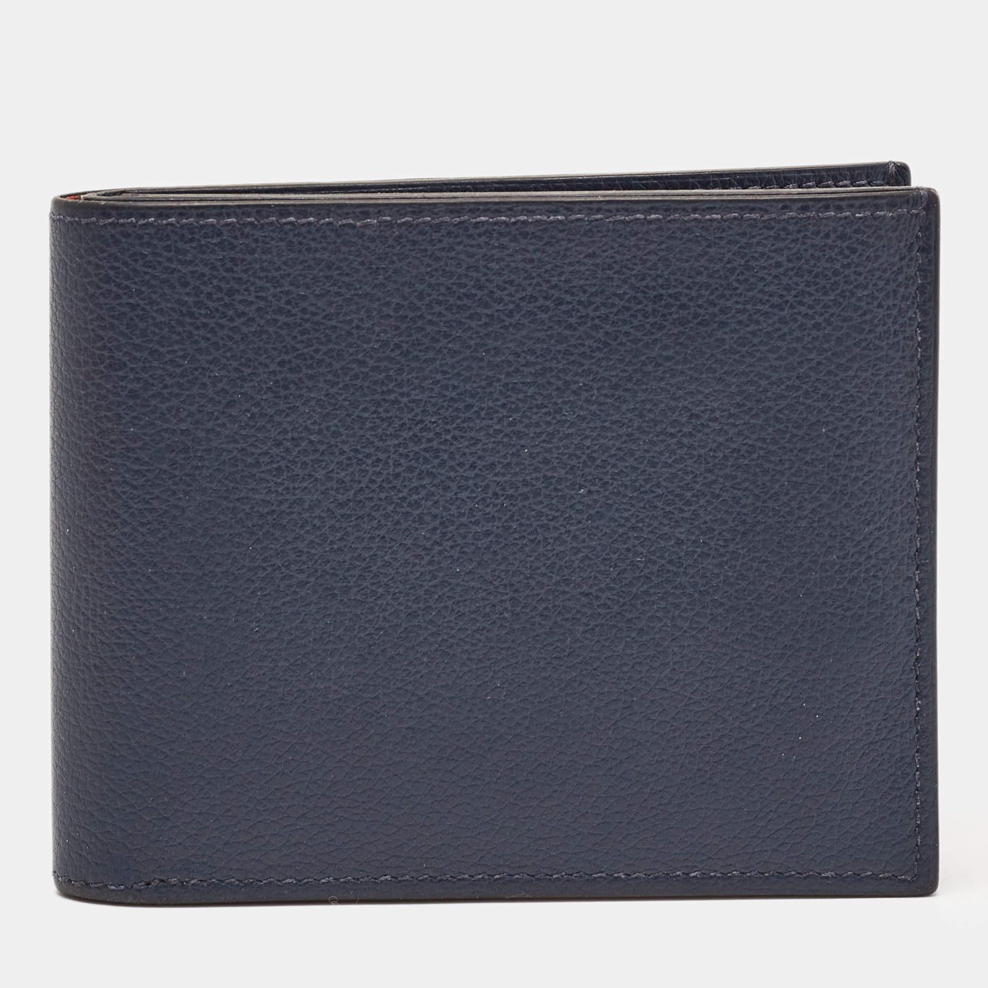 This wallet from Hermes brings along a touch of luxury and immense style. It comes crafted from blue leather and it is equipped with compartments and multiple slots so you can neatly carry your cards and cash.

