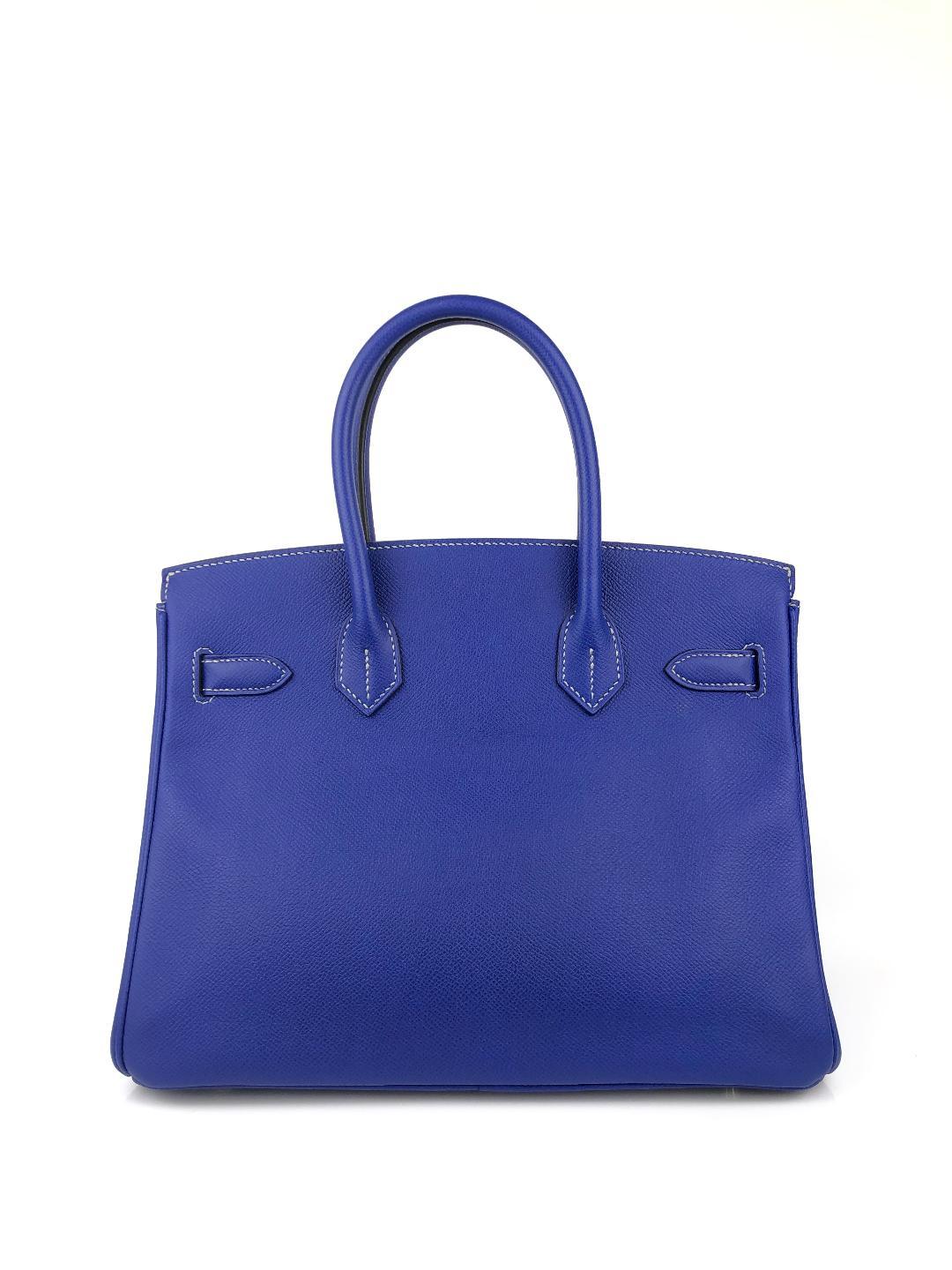 This authentic Hermès Blue Electric Epsom 30 cm Birkin is in pristine condition.   Considered the ultimate luxury item, the Hermès Birkin is stitched by hand. Long waitlists are commonplace.   Bleu Electrique, a vibrant blue, is a brilliant pop