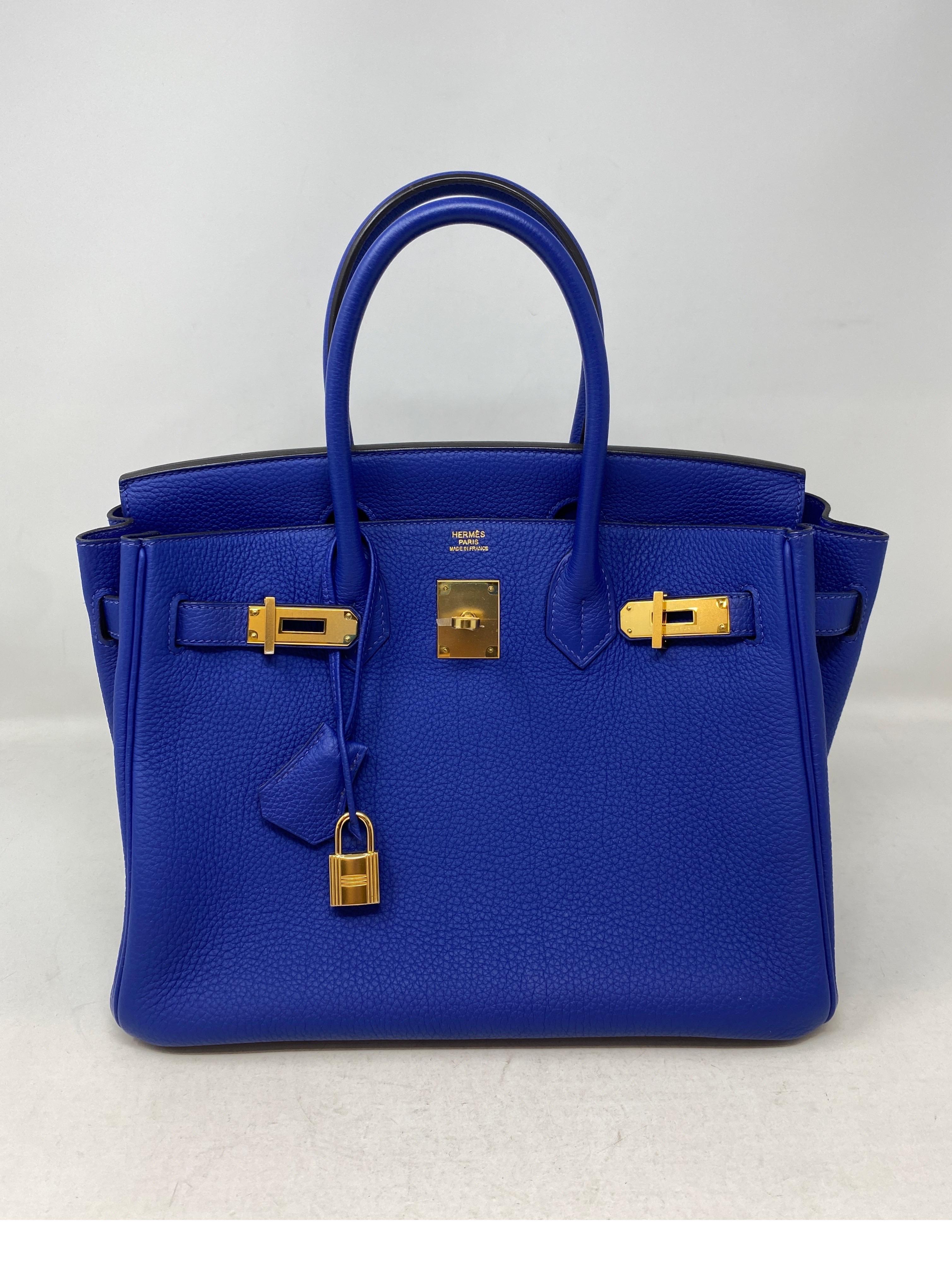 Hermes Blue Electrique 30 Bag. Gold hardware. Excellent condition. Looks like new. Vibrant blue color bag. Rare size and color. Includes clochette, lock, keys, and dust cover. Guaranteed authentic. 