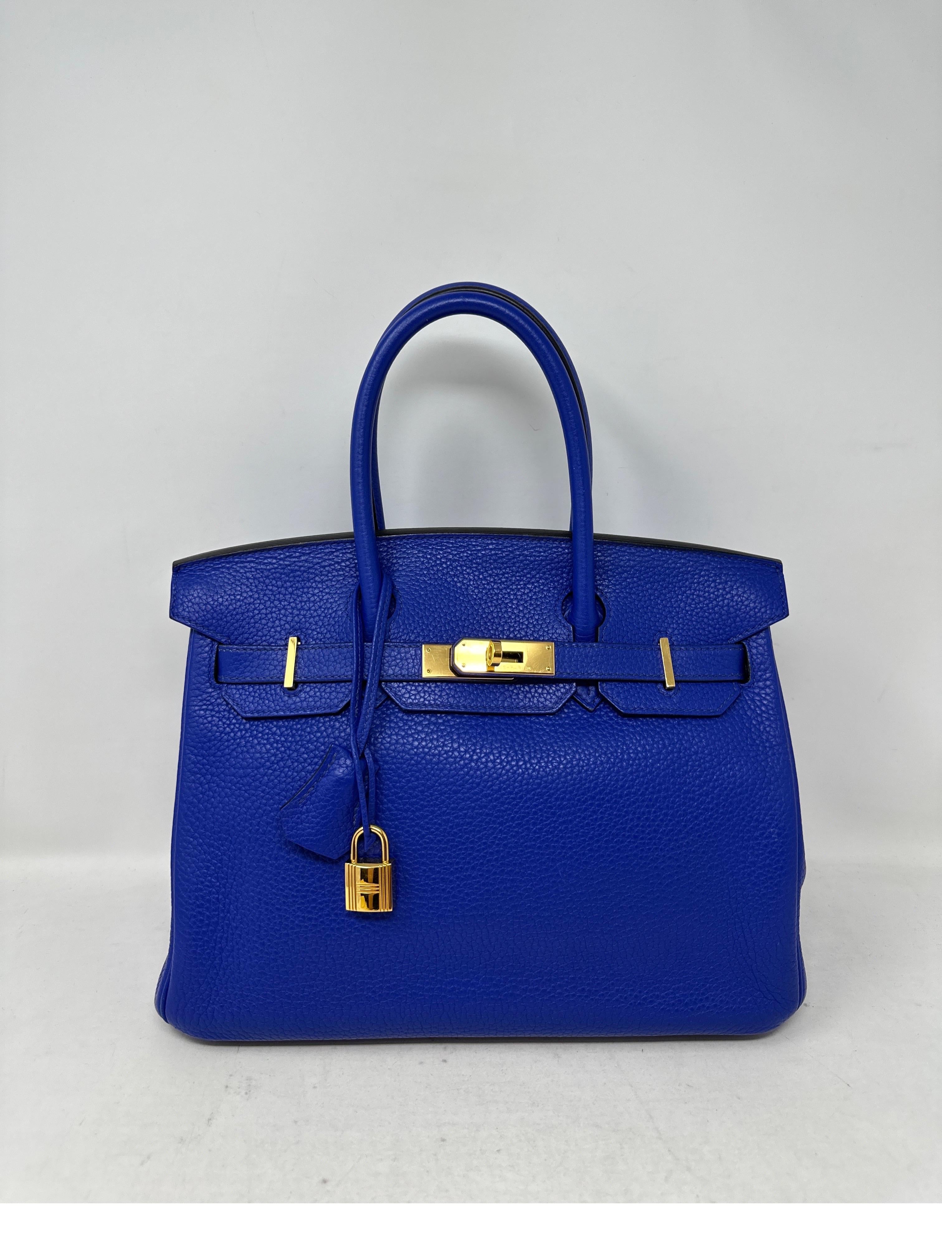 Hermes Blue Electrique Birkin 30 Bag. Excellent condition. Clemence leather. Gold hardware. Vibrant blue color. Most wanted size 30. Interior clean. Includes clochette, lock, keys, and dust bag. Guaranteed authentic. 
