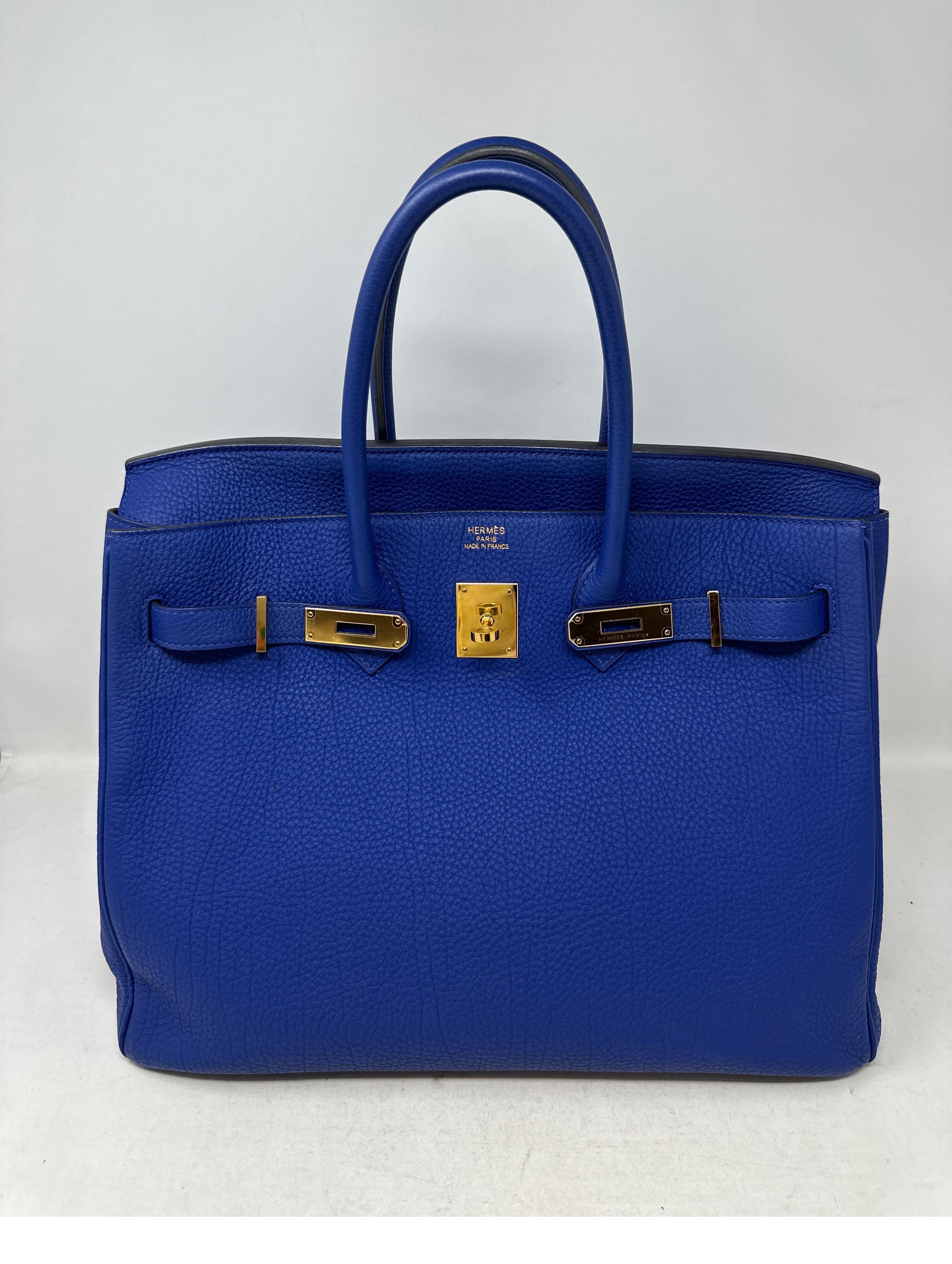 Hermes Blue Electrique Birkin 30 Bag. Excellent like new condition. Gold hardware. Interior clean. Most wanted size 30 Birkin. Rare and vibrant blue color. Togo leather. Invest in the best bag. Includes clochette, lock, keys, and dust bag.