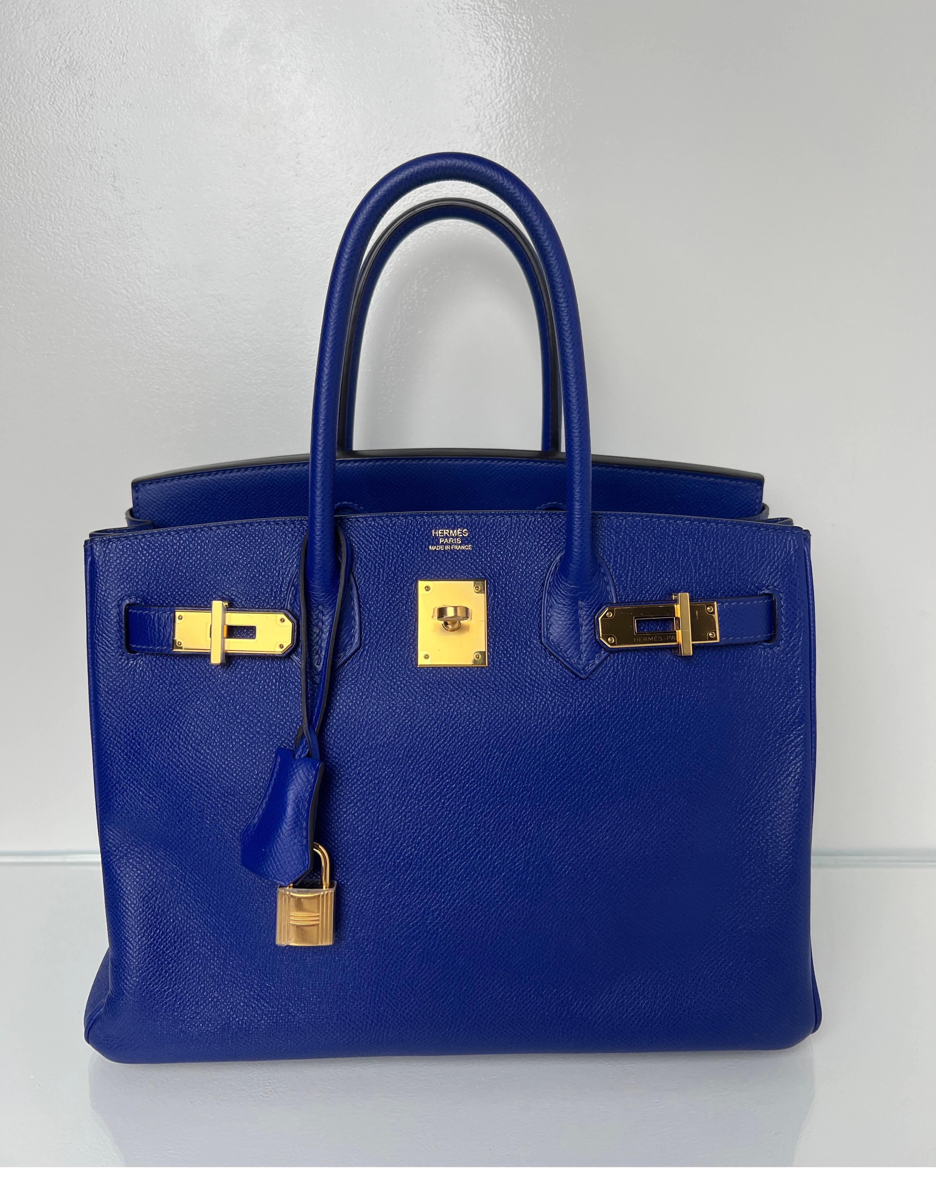 Hermes Blue Electrique Birkin 30 Bag. Dark blue vibrant color with gold hardware. Epsom leather. Interior clean. Excellent condition overall. Plastic is still on the hardware. Unique and rare color. Includes clochette, lock, keys, and dust bag.
