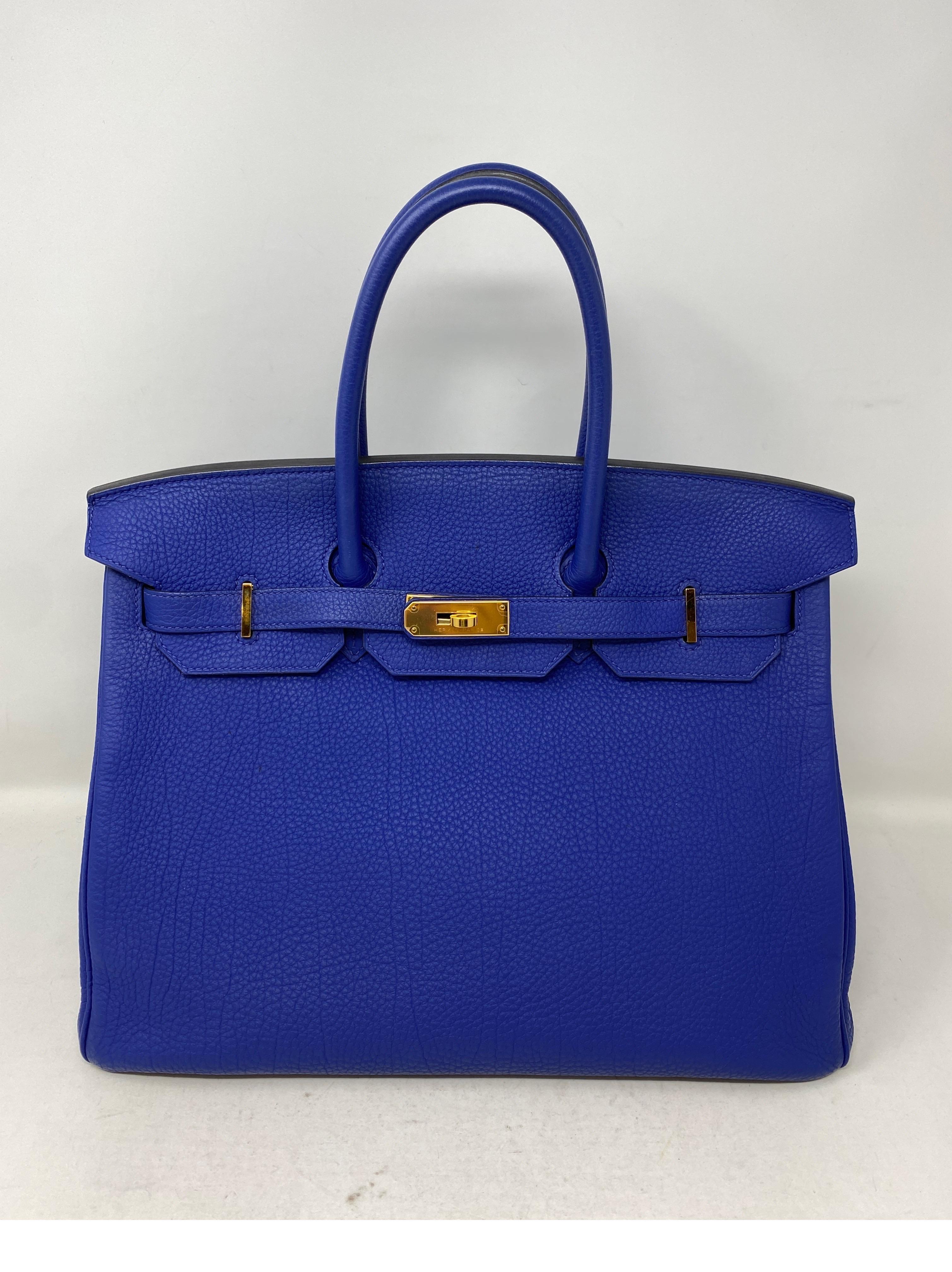 Hermes Blue Electrique Birkin 35 Bag. Stunning rare blue color with gold hardware. Togo leather. Looks new in mint condition. Collector's color. Includes clochette, lock, keys, and dust cover. Guaranteed authentic. 