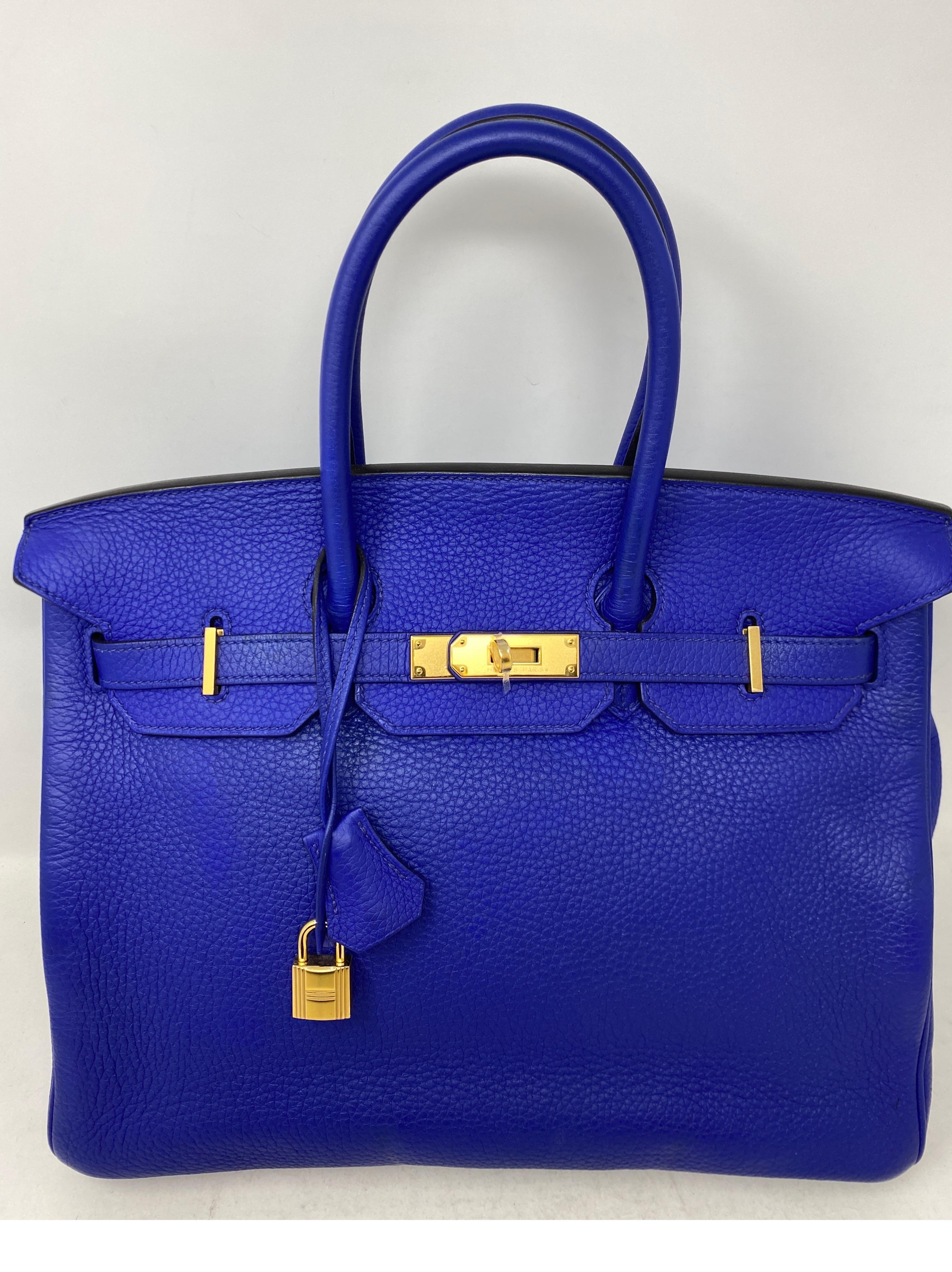 Hermes Blue Electrique Birkin 35 Bag. Good condition. Beautiful blue color.  Gold hardware. Clemence leather. Includes clochette, lock, keys, and dust cover. Guaranteed authentic. 