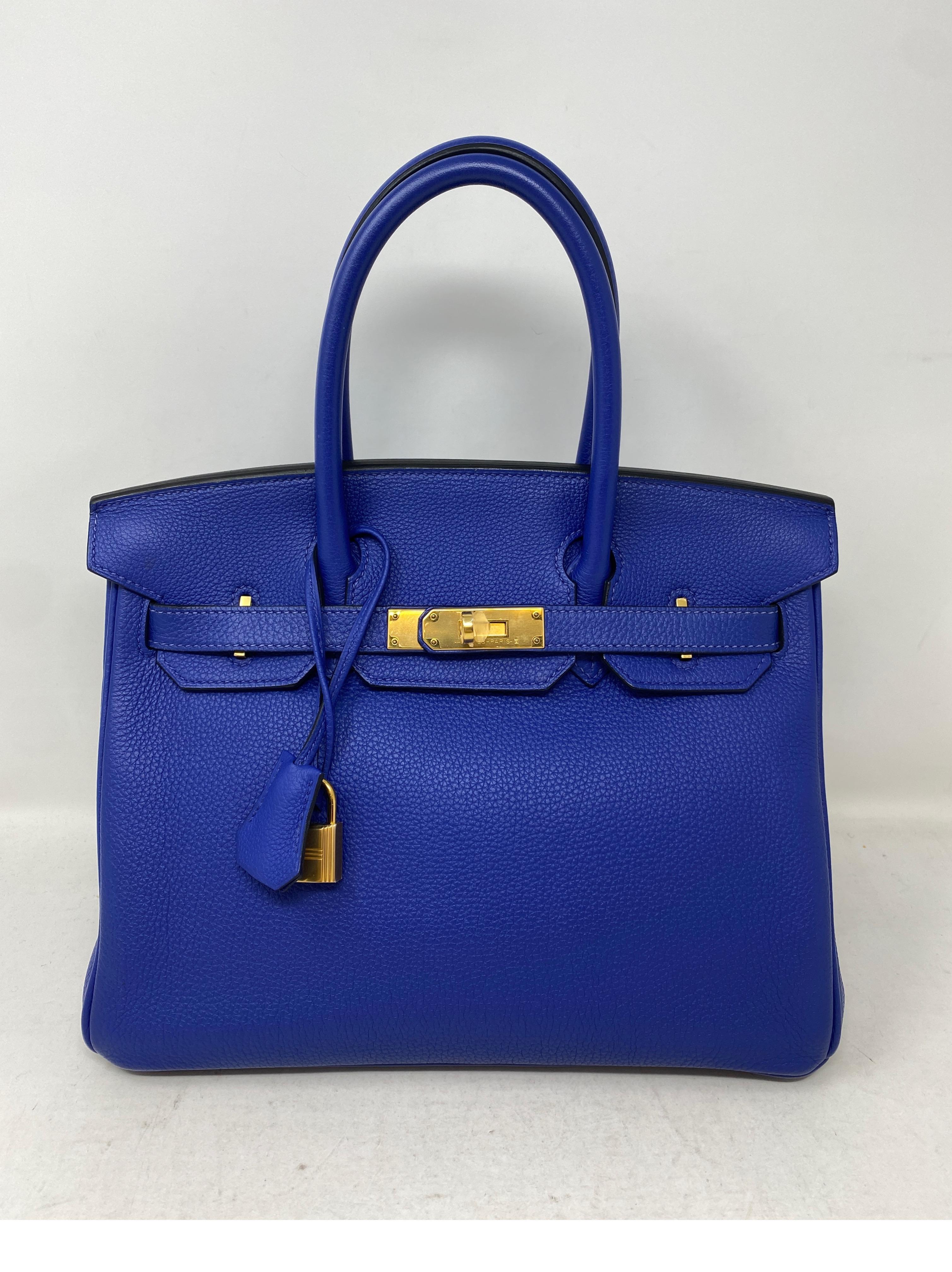 Hermes Blue Electrique Birkin 35 Bag. Electric blue color with gold hardware. Excellent condition. Looks like new. Gorgeous color and most wanted size 30 Birkin. Togo leather. Interior clean. Includes clochette, lock ,keys, and dust bag. Guaranteed