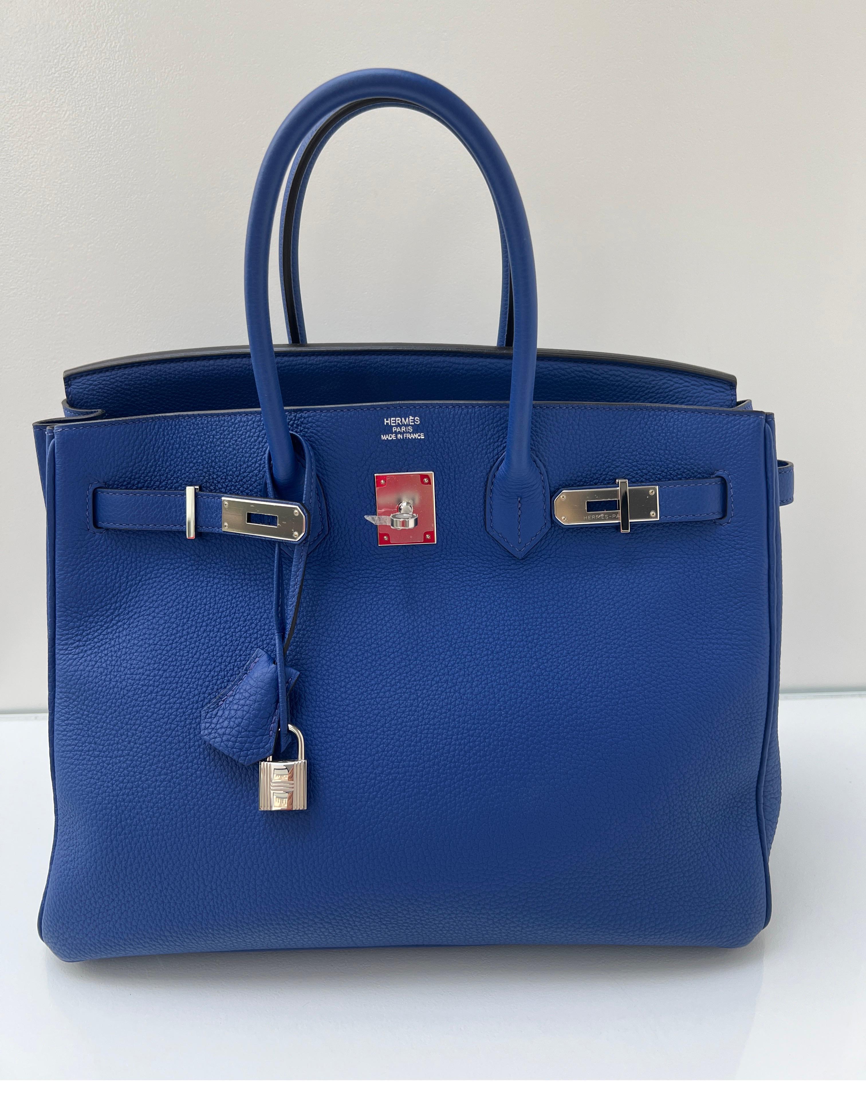 Hermes Blue Electrique Birkin 35 Bag. Gorgeous vibrant blue togo leather Birkin. Palladium silver hardware. Excellent like new condition. Gift worthy condition. Interior clean. Plastic still on all hardware. Includes clochette, lock, keys, and dust