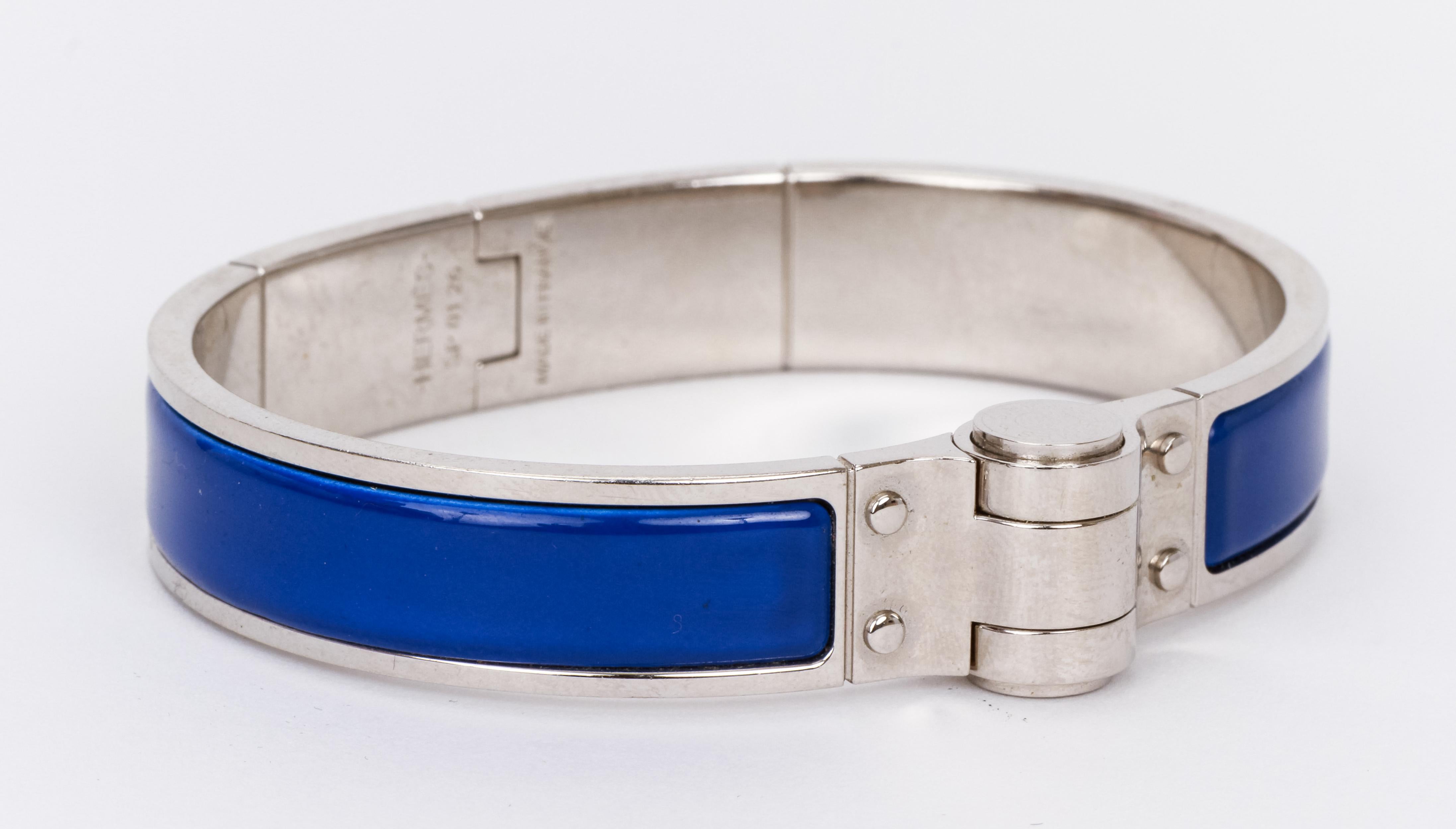Hermes Blue Enamel Hinge Silver Bangle Bracelet
Comes with velvet pouch. 