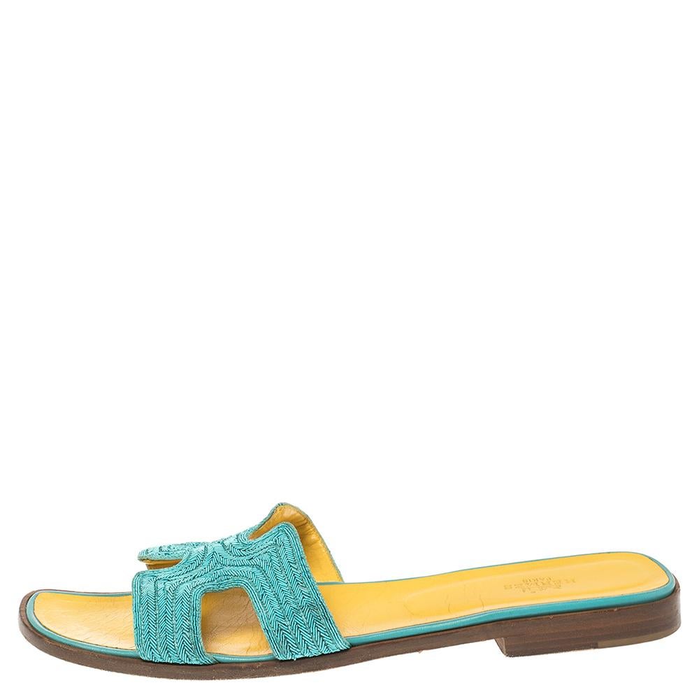 Put your best foot forward this season in these pretty Hermes sandals. These Blue Oran sandals have been crafted from quality fabric in Italy and they feature the iconic H on the vamps as well as insoles meant to provide comfort at every step. These