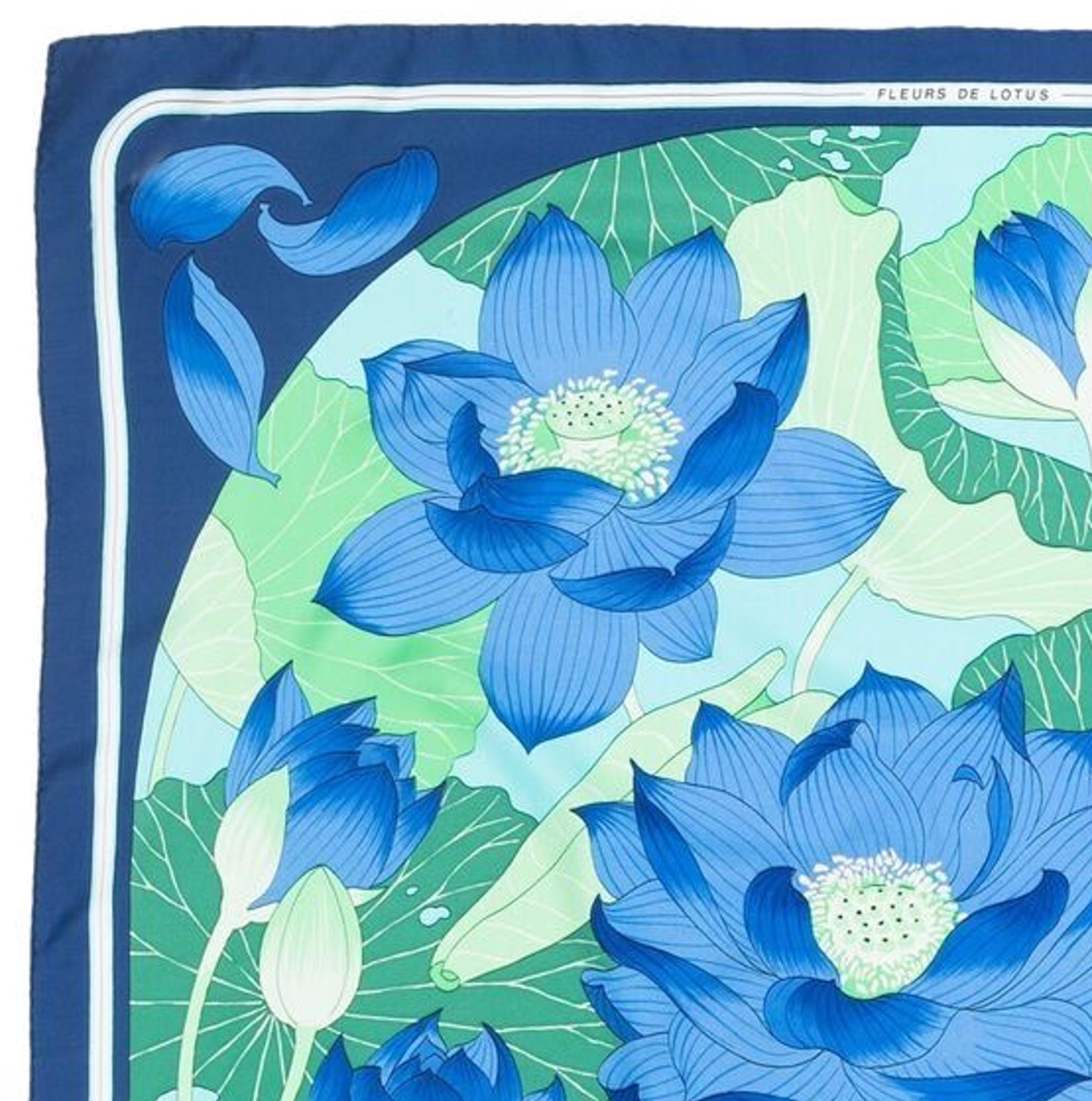 Hermes silk scarf Fleurs de Lotus by Christiane Vauzelle featuring blue, turquoise lotus floral scene.
Circa 1976s 
In excellent vintage condition. Made in France.
35,4in. (90cm)  X 35,4in. (90cm)
We guarantee you will receive this  iconic item as