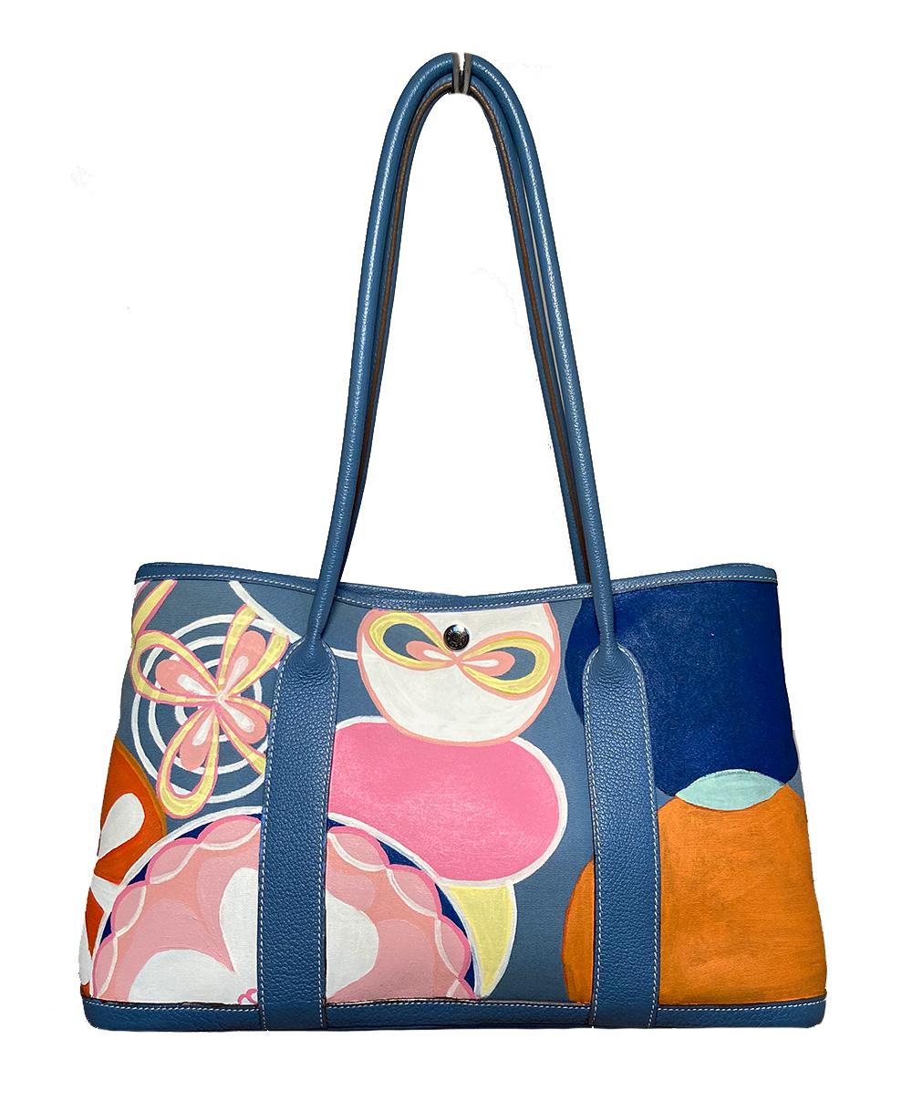 Hermes Blue Garden Party 40 Hand Painted in very good condition.  Hand painted blue canvas exterior trimmed with blue clemence leather and silver hardware. Two top leather shoulder straps can be worn or carried to suit any style. Hand painted canvas