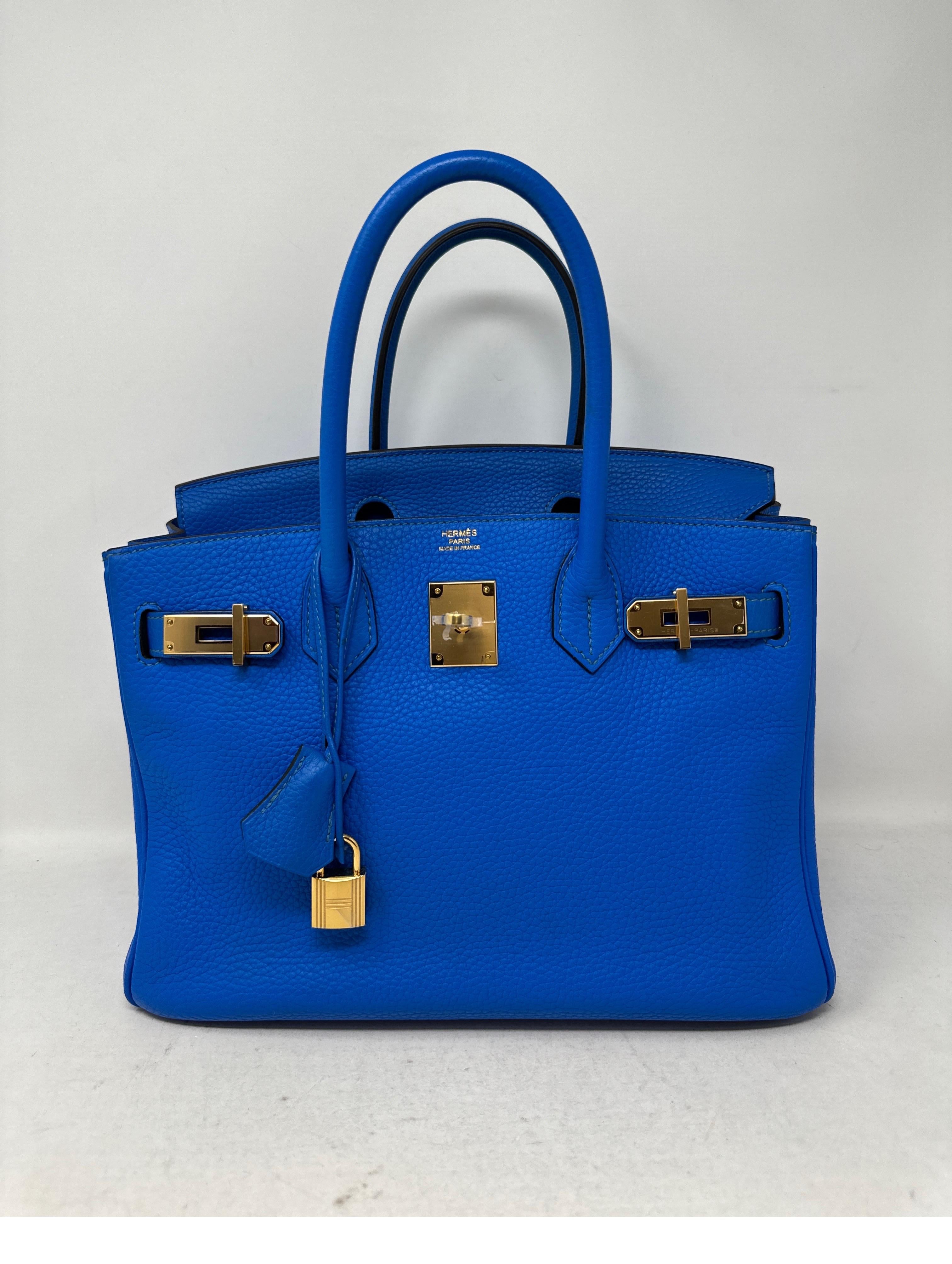 Hermes Birkin 30 Blue Hydra Birkin Bag. Clemence leather. Gold hardware. Stamp P. Excellent condition. Vibrant blue color. Most wanted size. Plastic is still on the hardware. Interior clean. Includes clochette, lcok, keys, and dust bag. Guaranteed