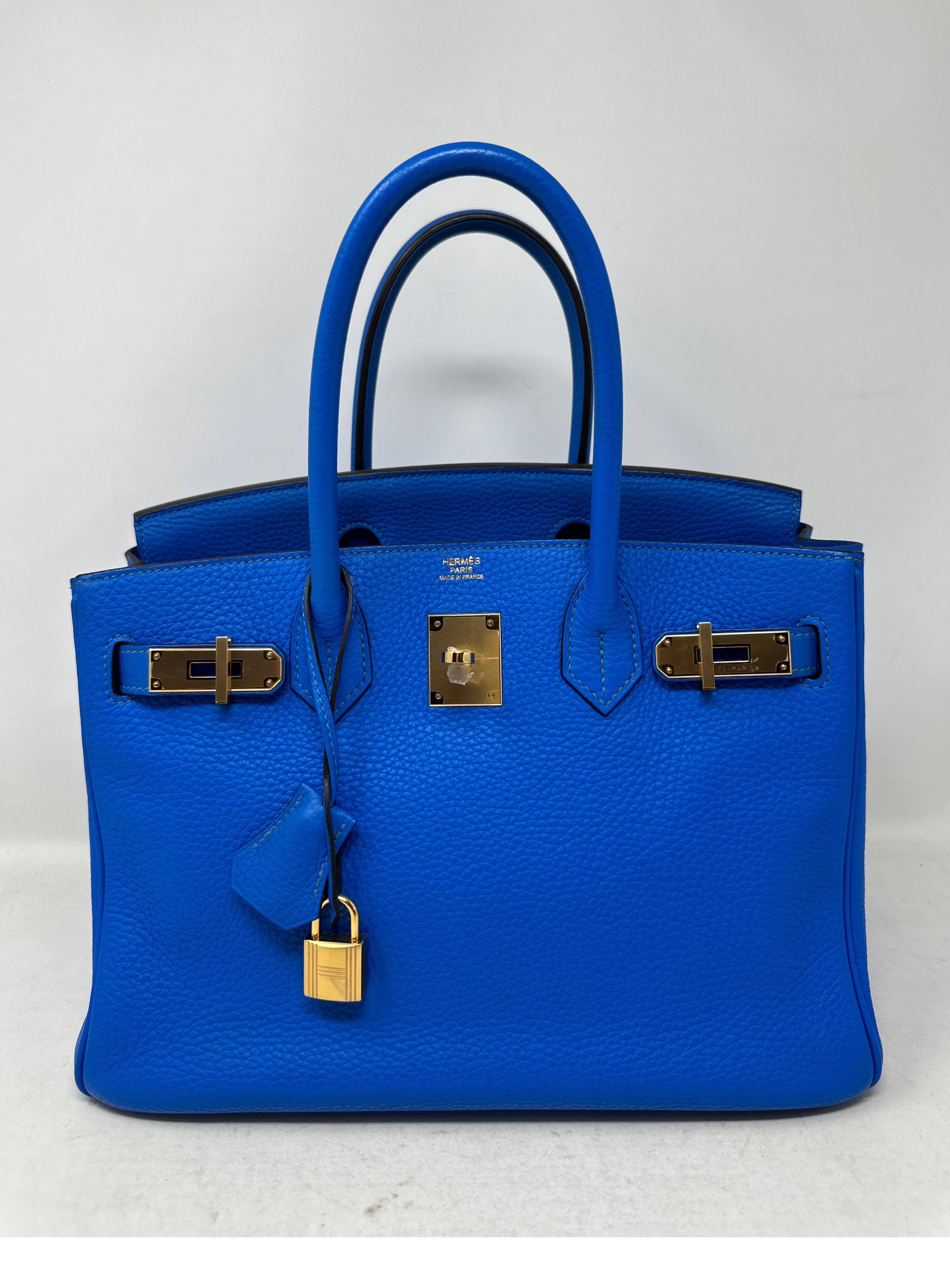 Hermes Blue Hydra Birkin 30 Bag. Vibrant blue color Birkin. Excellent condition. Gold hardware. Plastic is still on the hardware. Interior is mint and clean. Rare blue color and size. Includes clochette, lock, keys, and dust bag. Guaranteed