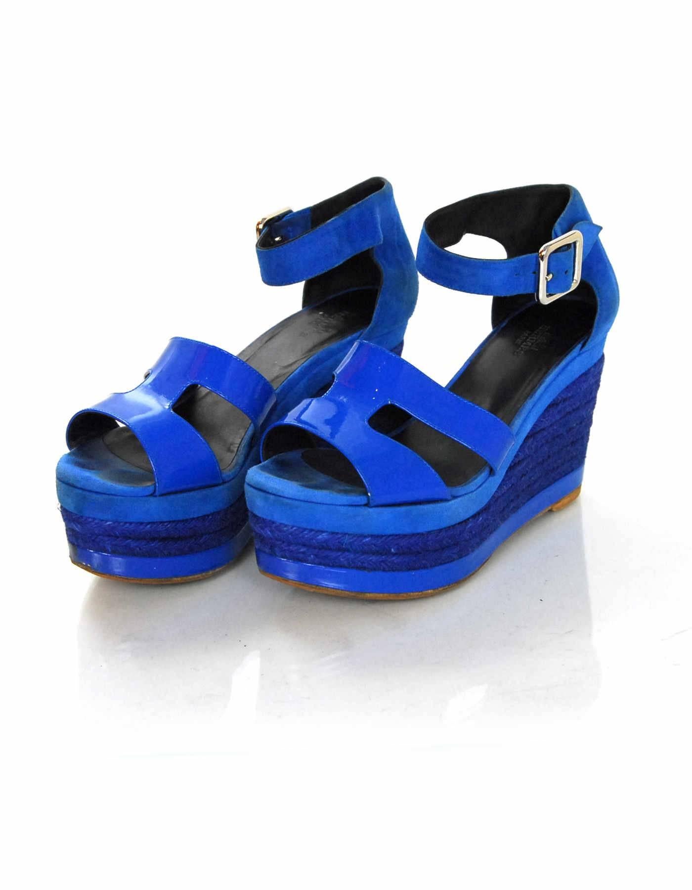 Hermes Blue Ilana Espadrille Sandals Sz 35

Made In: Spain
Color: Blue
Materials: Patent leather, suede, jute rope
Closure/Opening: Buckle closure at ankle
Sole Stamp: Hermes 35 Made in Spain
Retail Price: $920 + tax
Overall Condition: Good