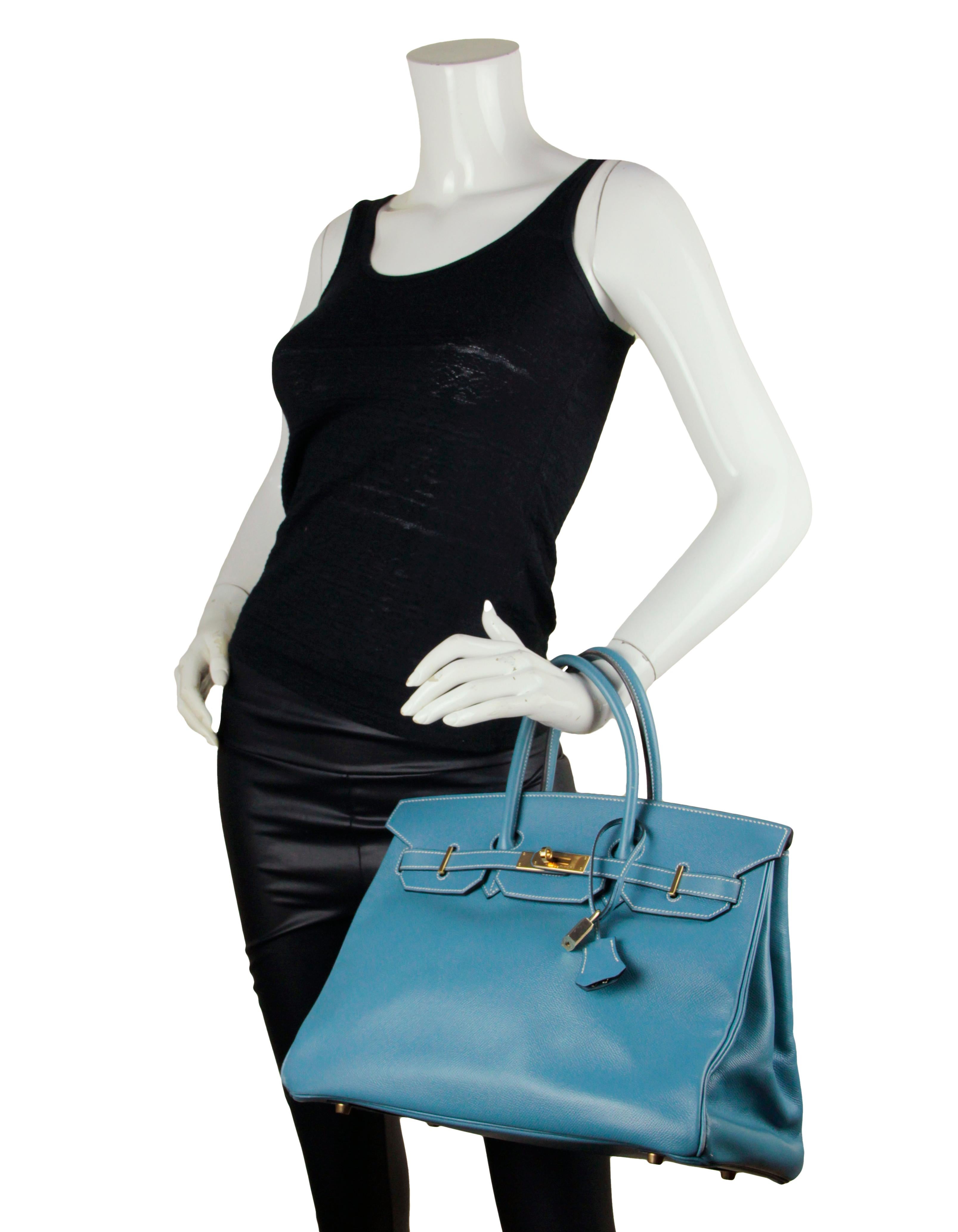 Hermes Blue Jean Epsom Leather 35cm Birkin Bag GHW

Made In: France
Year of Production: 1997
Color: Blue jean
Hardware: Gold
Materials: Epsom
Lining: Chevre leather
Closure/Opening: Double arm strap with twist lock
Interior Pockets: One zip and one