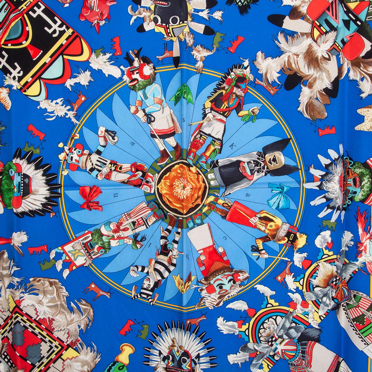 100% authentic Hermes 'Kachinas 90' scarf by Kermit Oliver in light and dark blue silk twill (100%) with details in yellow, red, green and grey. Has been worn and is in excellent condition.

Width 90cm (35.1in)
Height 90cm (35.1in)

All our listings