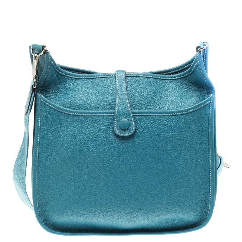 Hermes is a brand that delivers crafts with art and creativity. Crafted from blue lagon togo leather and featuring an adjustable shoulder strap, this Evelyne III PM is a classic. The bag comes with a spacious leather lined interior and a buttoned