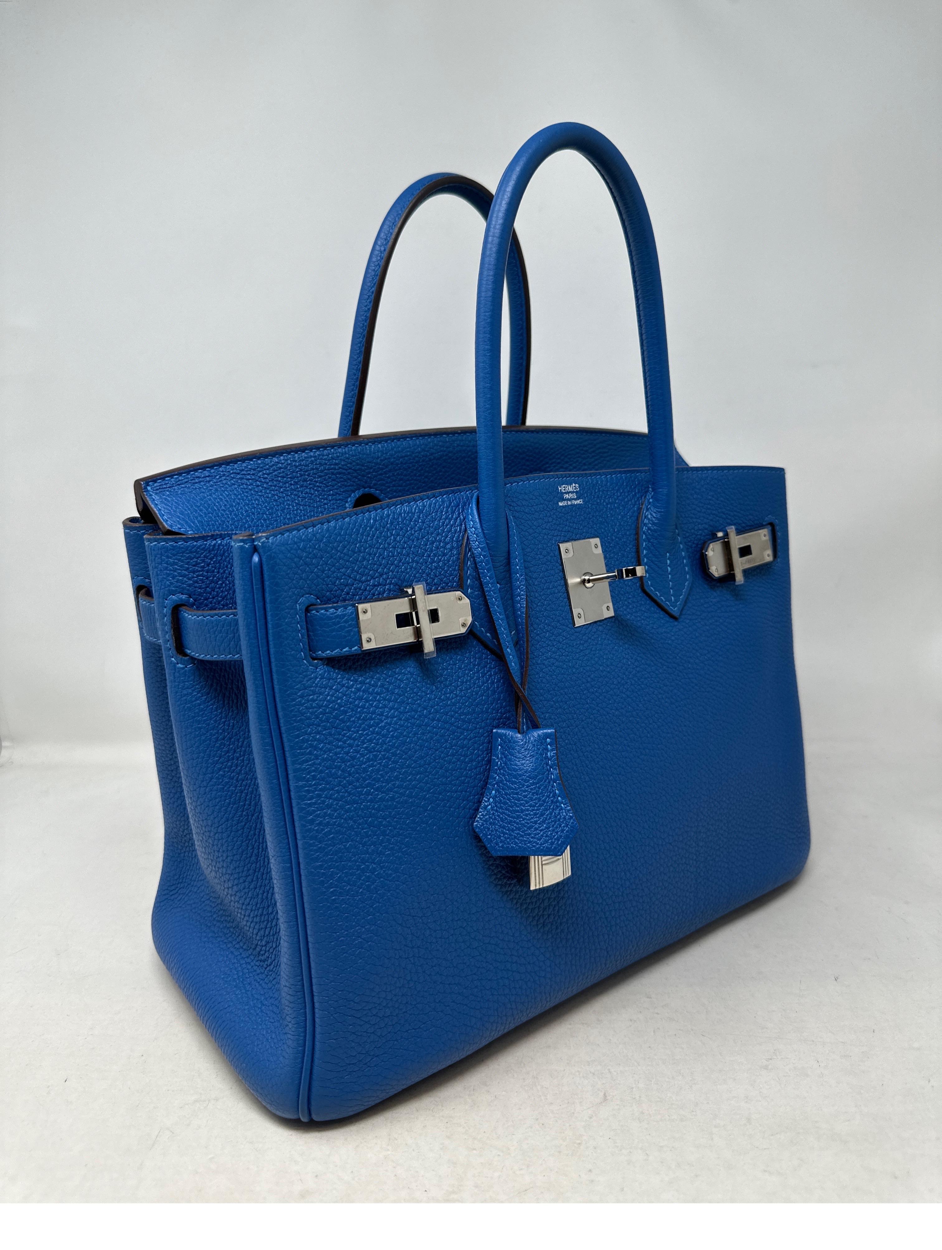 Hermes Blue Mykonos Birkin 30 Bag. Excellent like new condition. Rare blue color with palladium hardware. Plastic still on hardware. Interior clean. Bag looks unused. Most wanted 30 size. Togo leather. Includes clochette, lock, keys, and dust bag.