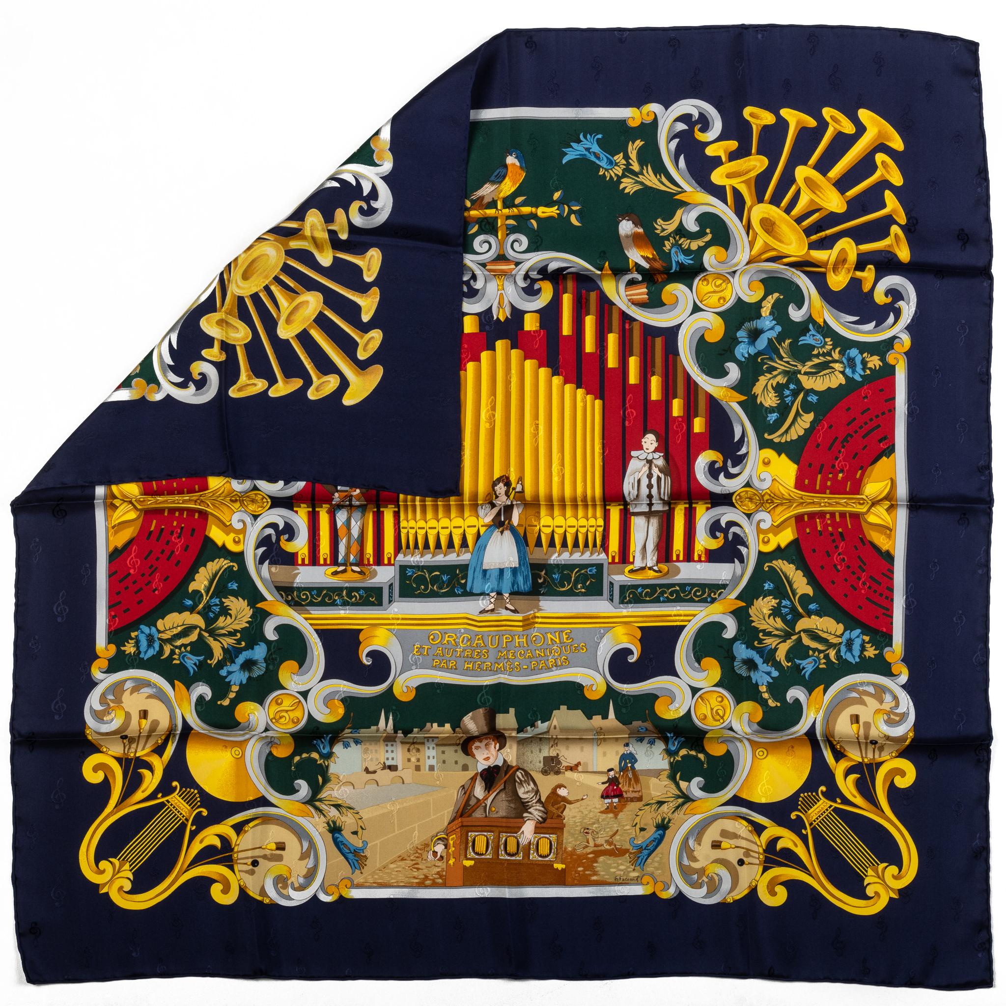 Hermes collectible orgauphone silk scarf in blue and yellow. Hand rolled edges. No box included.