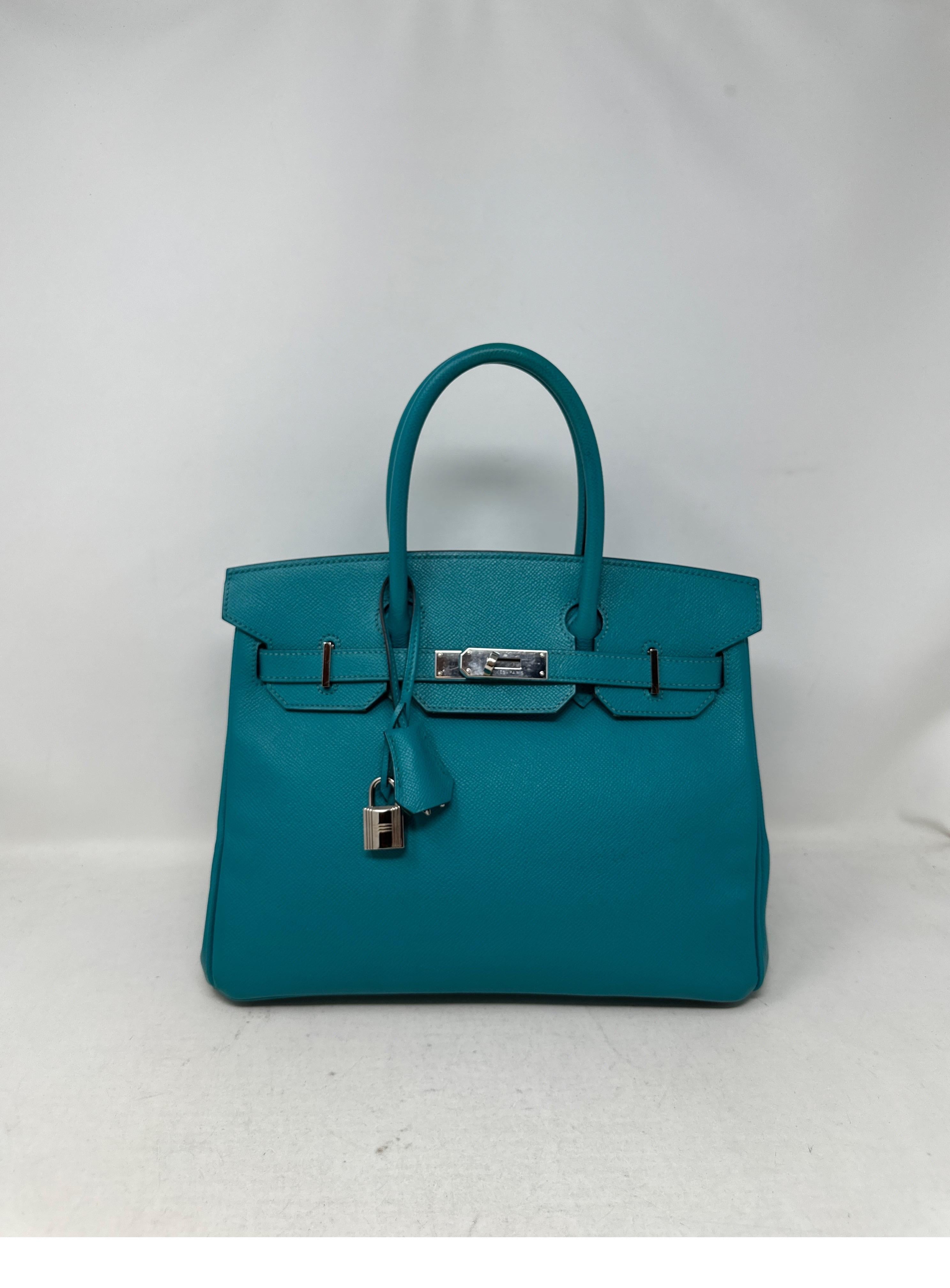 Hermes Blue Paon Birkin 30 Bag. Excellent condition. Epsom leather. Interior is clean. Palladium silver hardware. Plastic is still on hardware. Looks like new. Rare blue color. Most wanted size. Includes clochette, lock, keys, and dust bag.