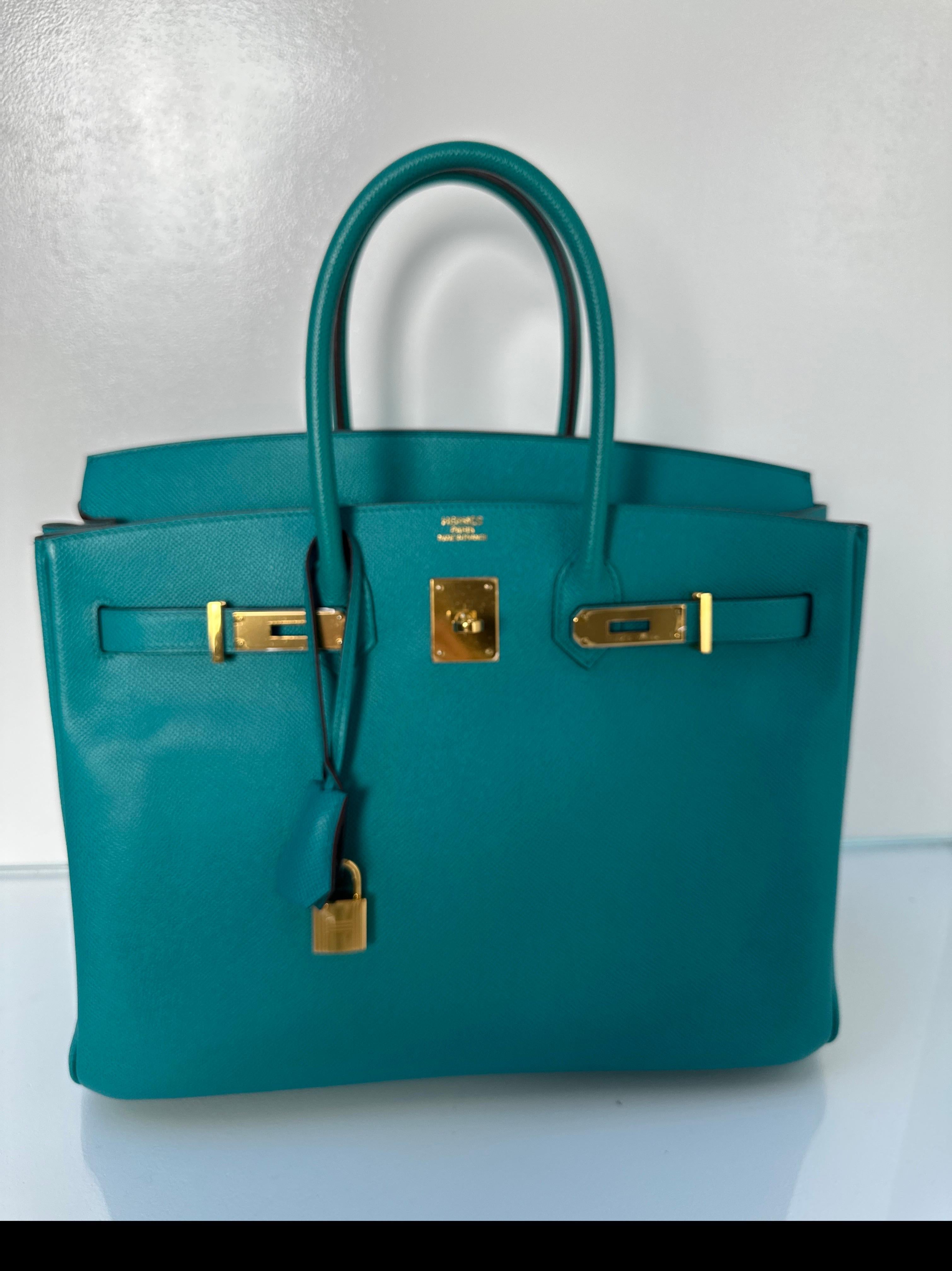 Hermes Blue Paon Birkin 35 Bag. Gold hardware. Teal blue color Birkin in epsom leather. Unique color and in excellent like new condition. Plastic is still on the hardware. Gift worthy and great collector's piece. Includes clochette, lock, keys, and