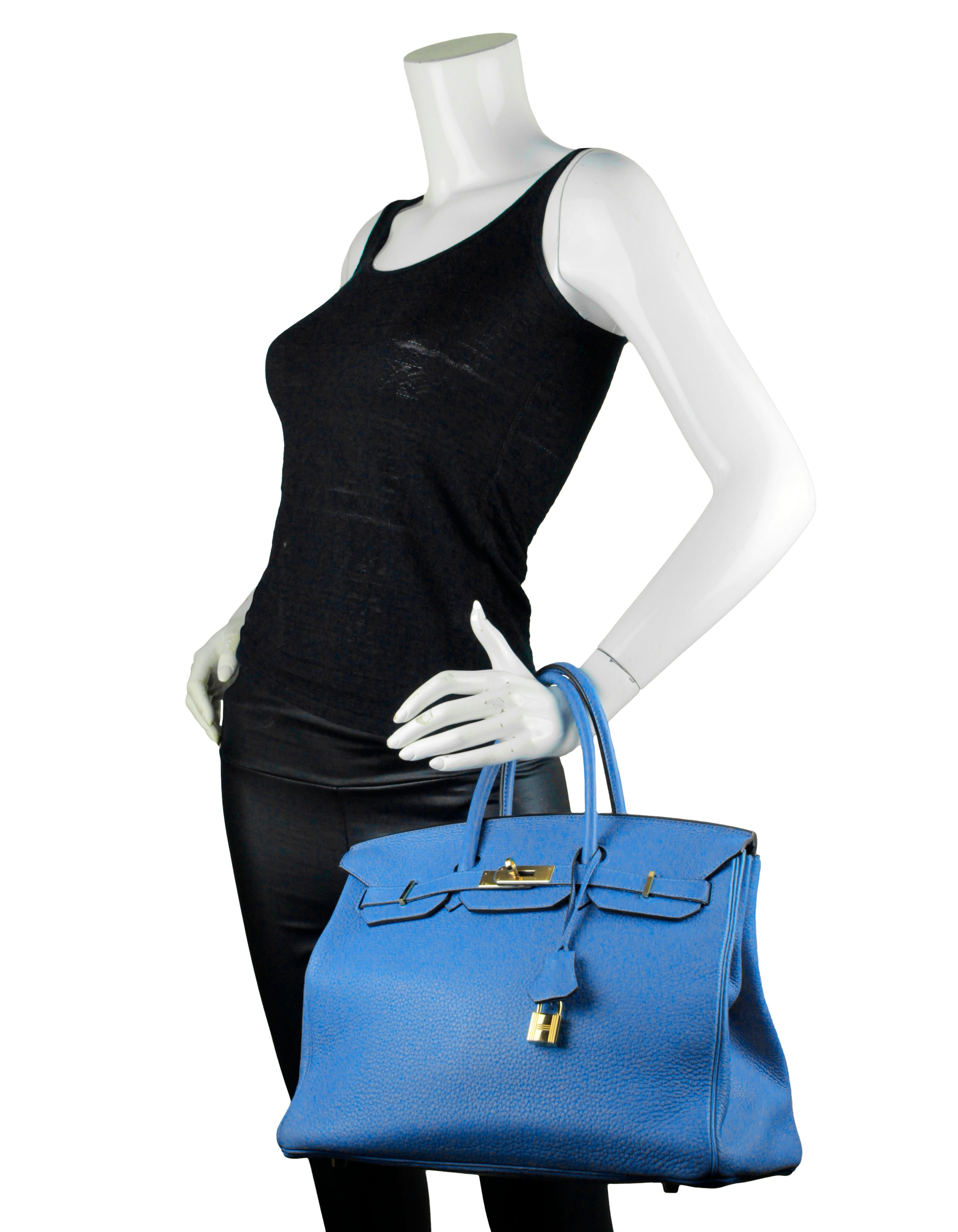 Hermes Bleu Paradis Taurillon Clemence Leather 35cm Birkin Bag

Made In: France
Year of Production: 2014
Color: Blue paradis
Hardware: Goldtone
Materials: Taurillon clemence leather
Lining: Chevre leather
Closure/Opening: Double arm strap with twist