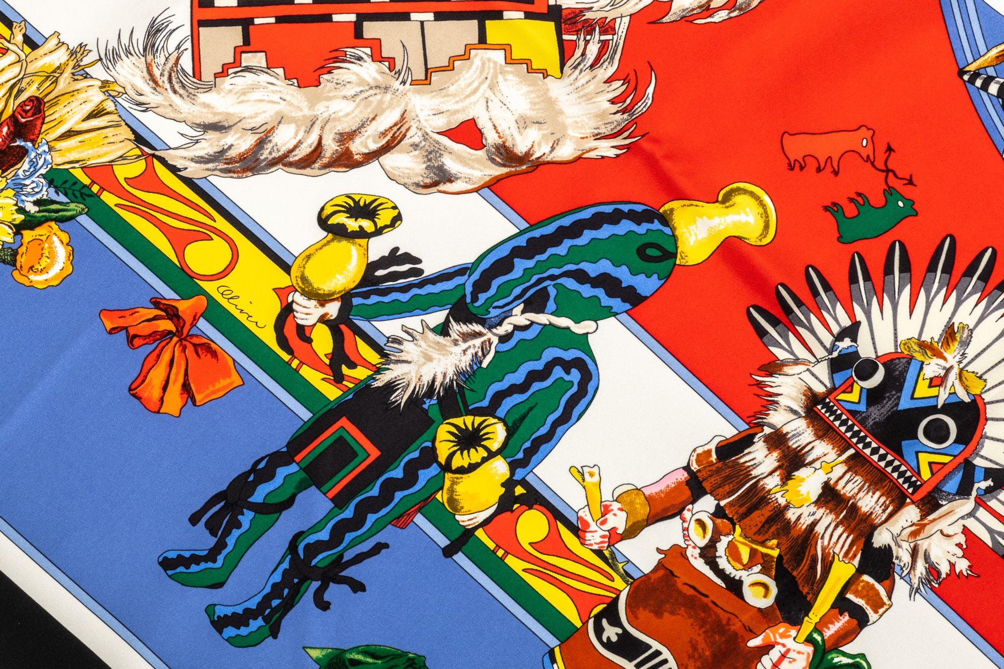 Hermès red-and-blue silk pointe Kachinas scarf. Hand-rolled edges. Brand new in unused condition. Original box included.