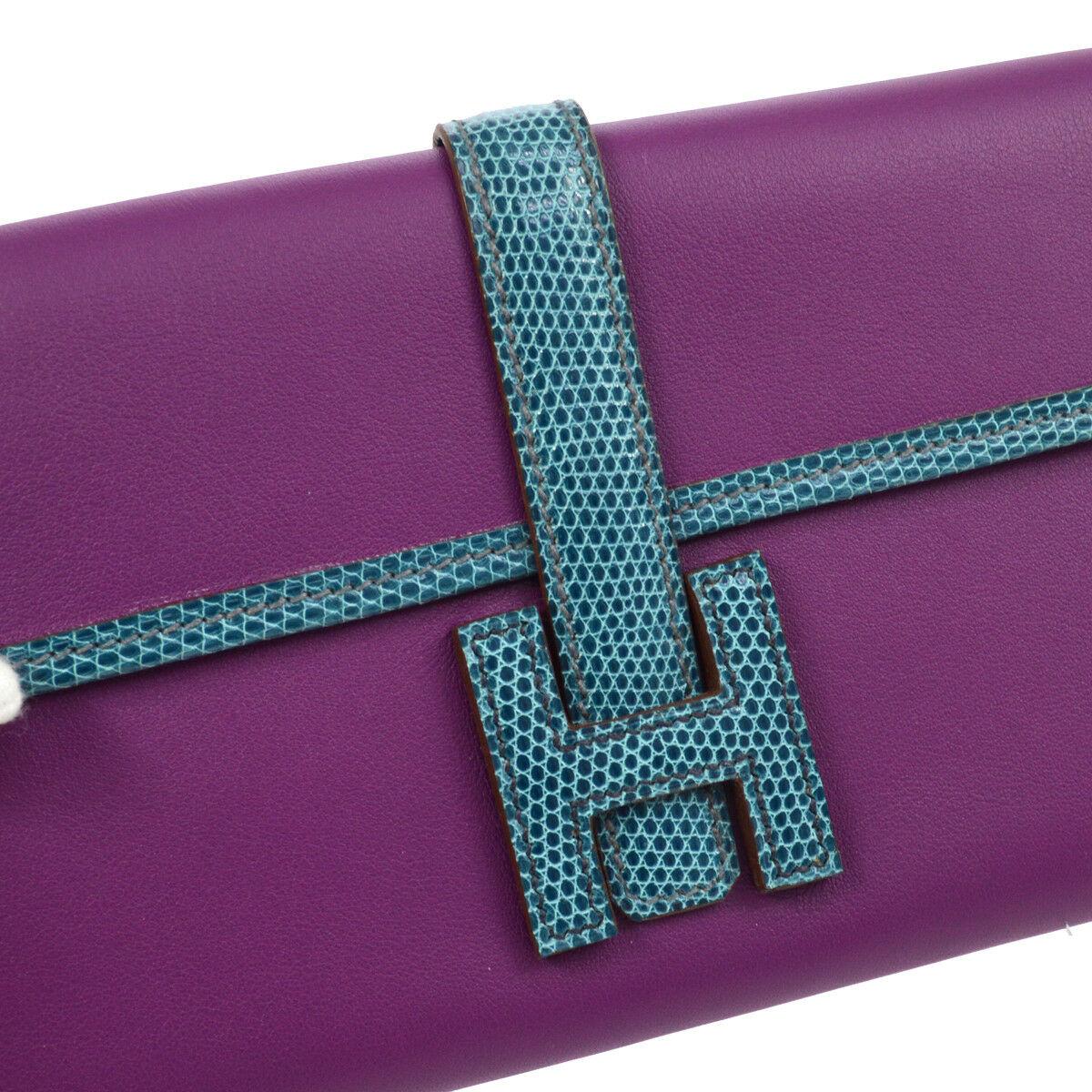 Hermes Blue Purple Lizard Exotic Leather Evening 'H' Logo Jige Wallet Clutch Bag in Box

Leather
Lizard
Leather lining
Fold in buckle closure
Made in France
Measures 8.5