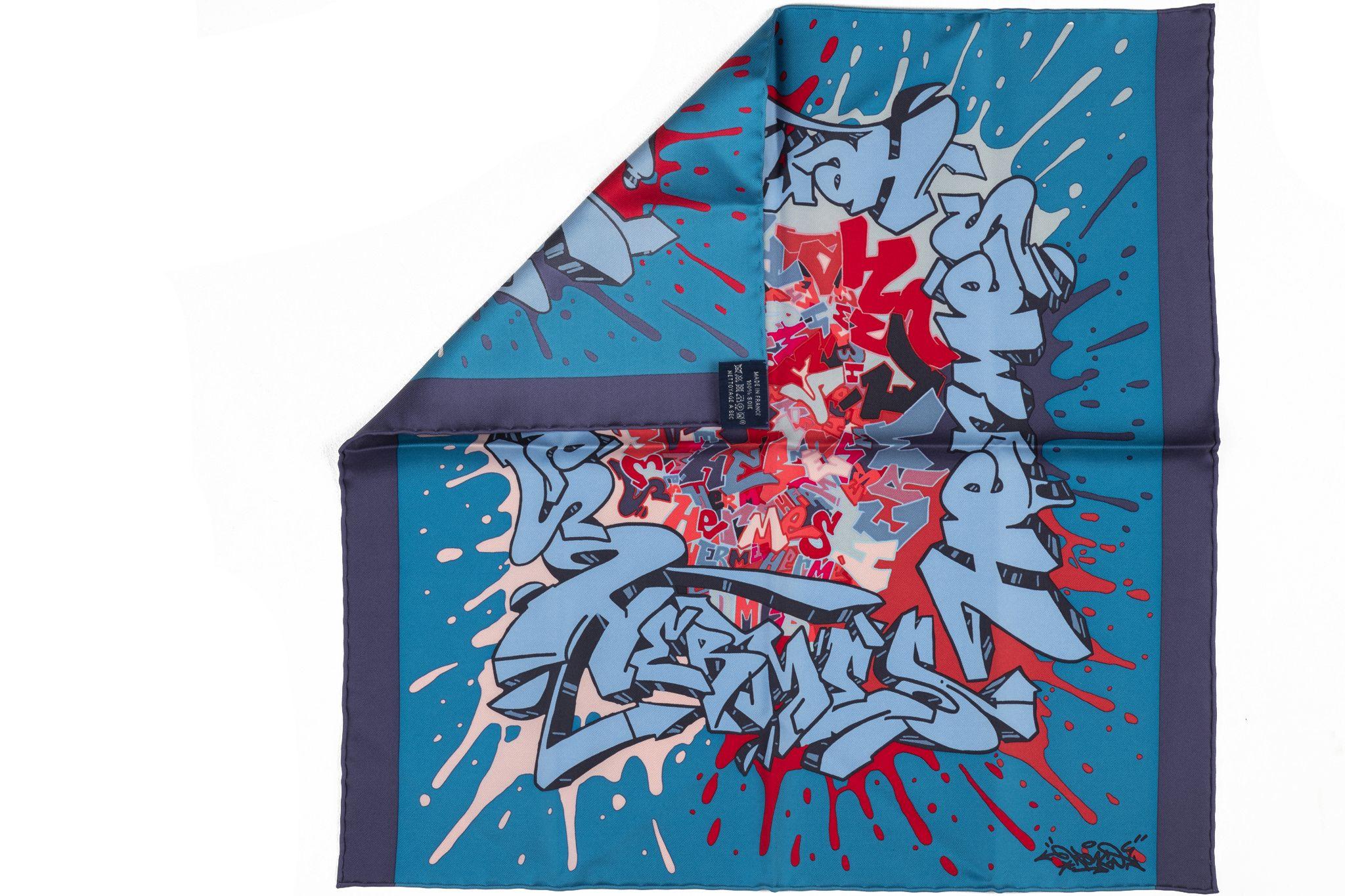 Hermès new rare blue and red graffiti silk gavroche . Hand rolled trim. Comes with original box.