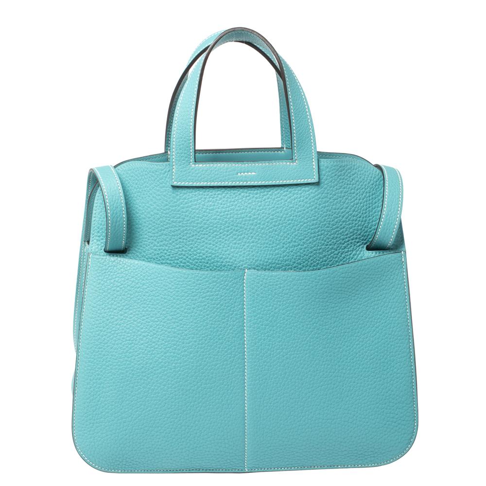 This Halzan from Hermes will make the dream of innumerable women come true. Crafted from leather, this bag has a blue shade and it comes ready with two top handles, and a shoulder strap. You're sure to fall in love with this creation as it can be