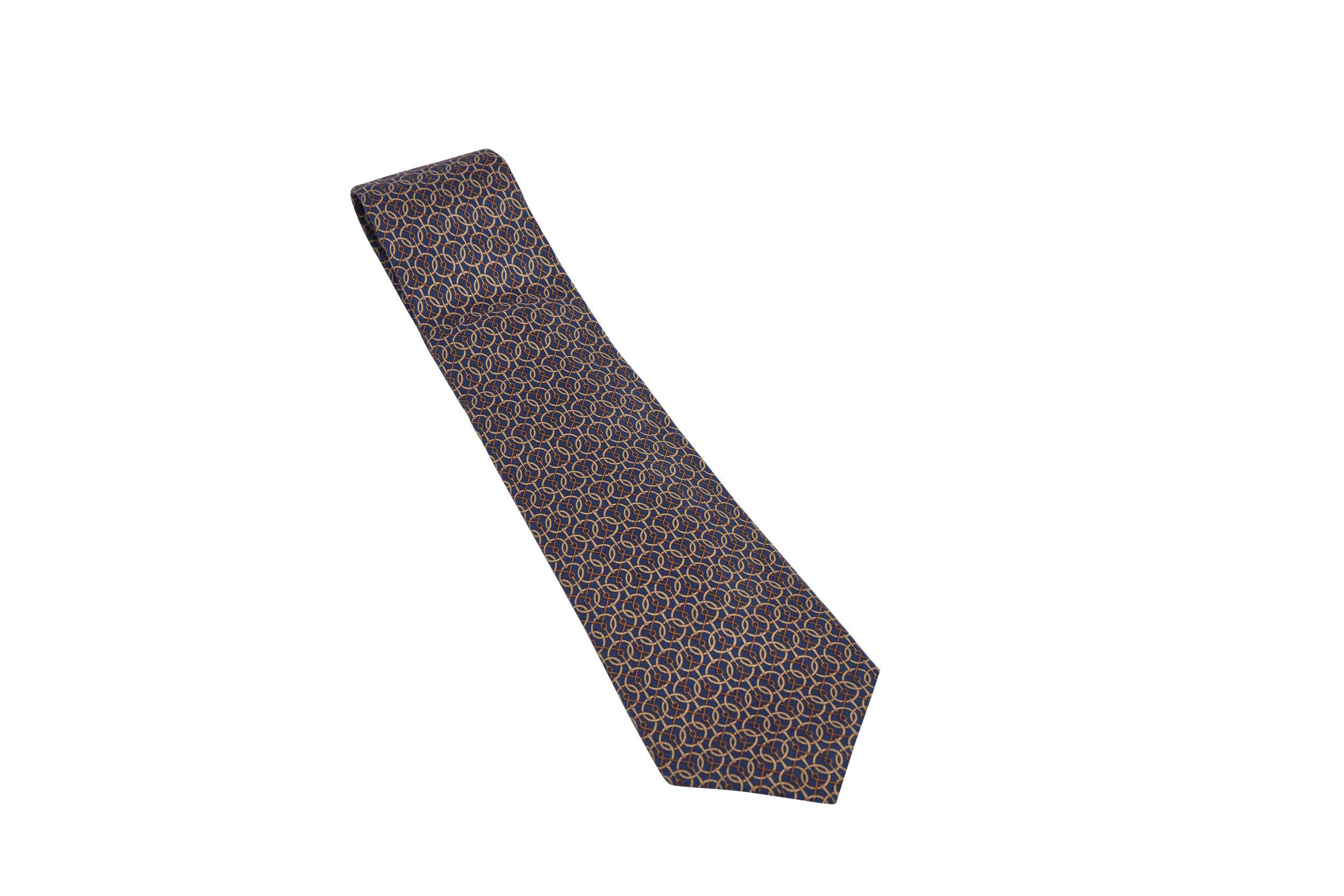 Hermes dark blue silk tie with gold and brown horse pattern Blue lining Comes with original box