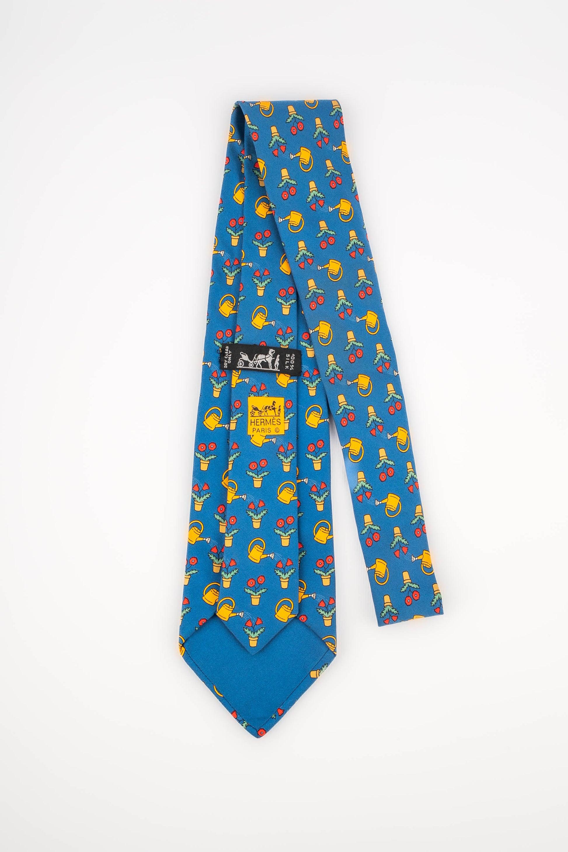 Hermès Blue Silk Tie Illustrated with Flowers and Watering Cans In Excellent Condition In SAINT-OUEN-SUR-SEINE, FR