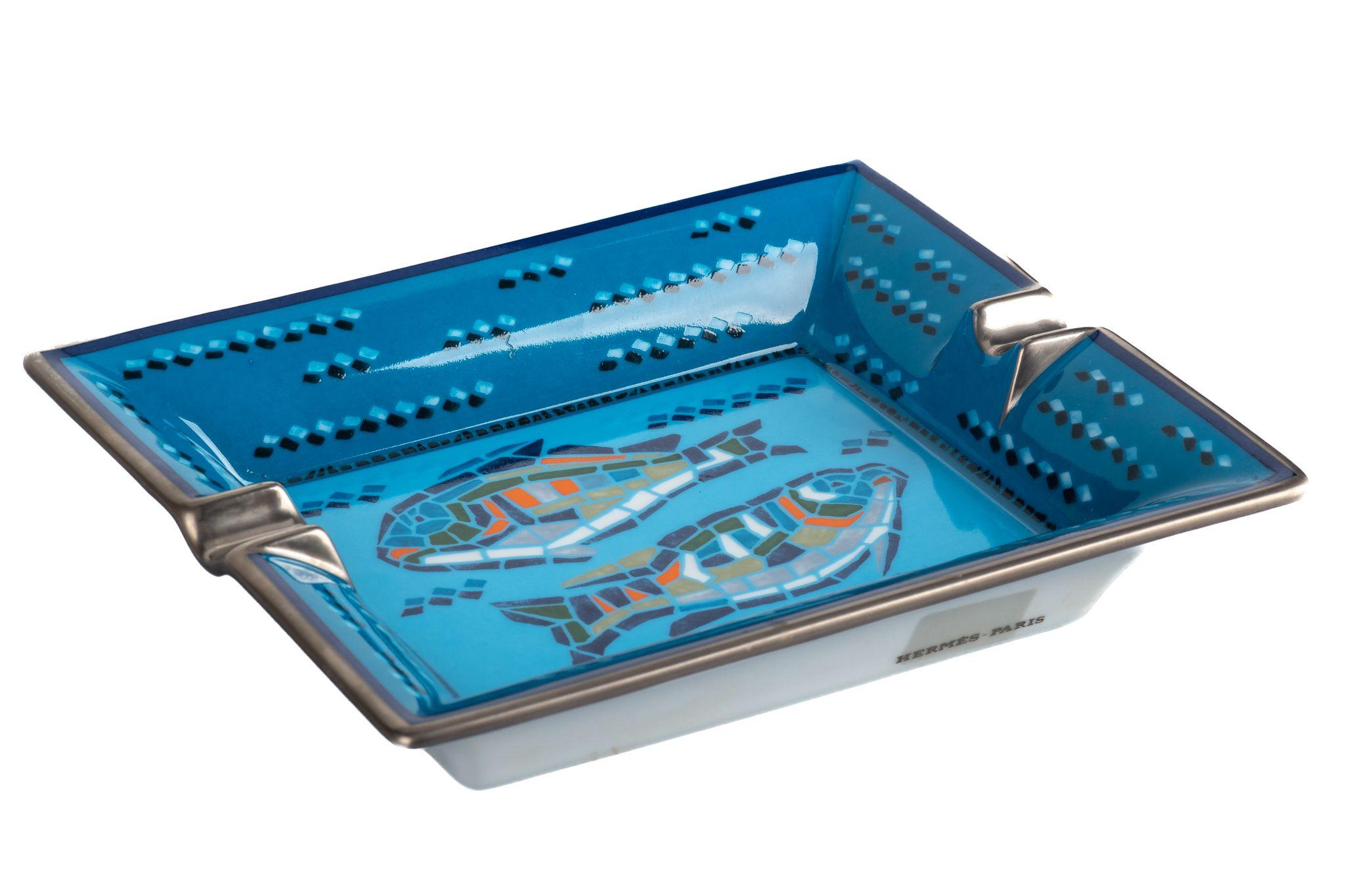 Hermes signature ashtray with fish design in blue and silver. Missing bottom suede. Minor wear on it. Made in France.