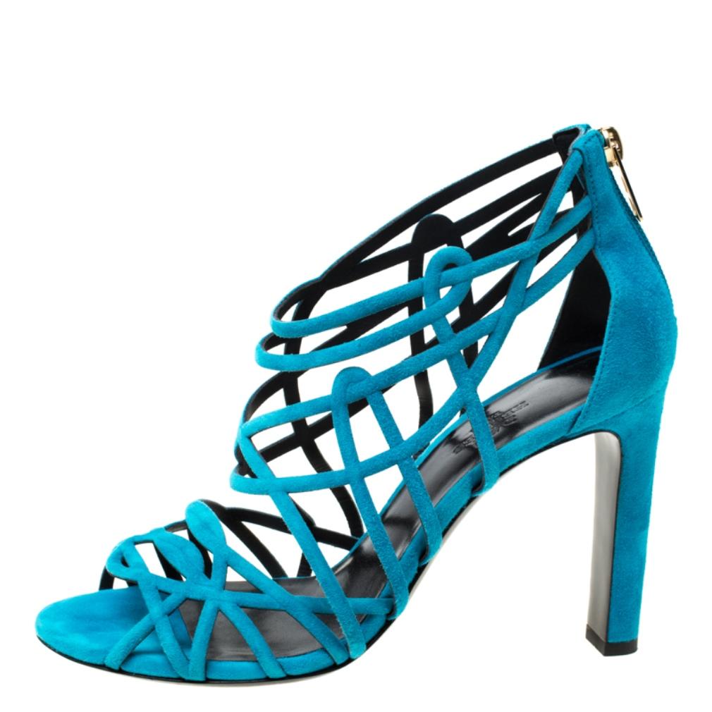 These magnificent blue sandals from Hermes are here to make you look fabulous! They are crafted from suede in a strappy design and feature a peep-toes. They flaunt comfortable leather-lined insoles, back zippers, and 10.5 cm high heels.

Includes: