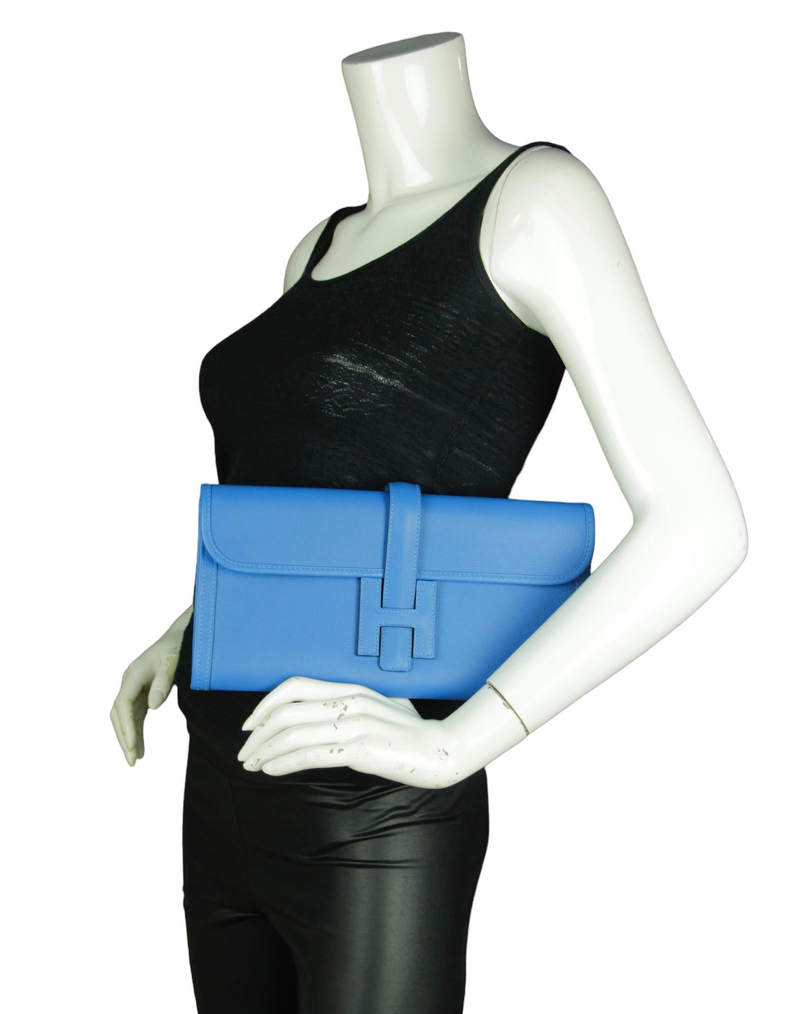 Hermes Blue Swift Leather Jige Elan Clutch Bag

Made In: France
Year of Production: 2020
Color: Bleu Frida Blue
Materials: Swift leather
Lining: Smooth leather
Closure/Opening: Flap top w/slide strap through H
Exterior Condition: Excellent
Interior