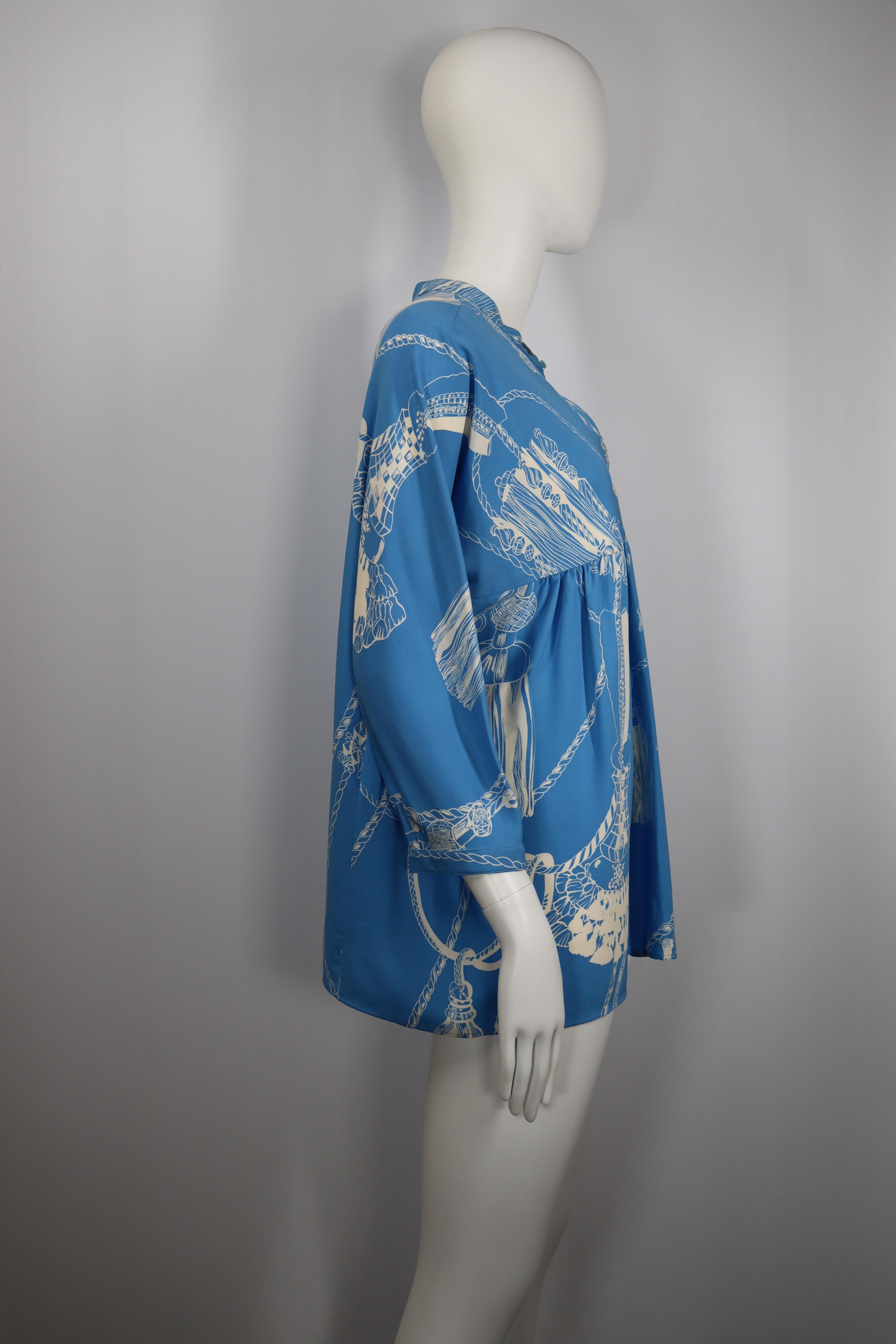 Very good condition, shows some signs of use and wear but nothing visible
Blue silk shirt with white prints with a button at the top and an open neckline 
Height 67 cm / 26 