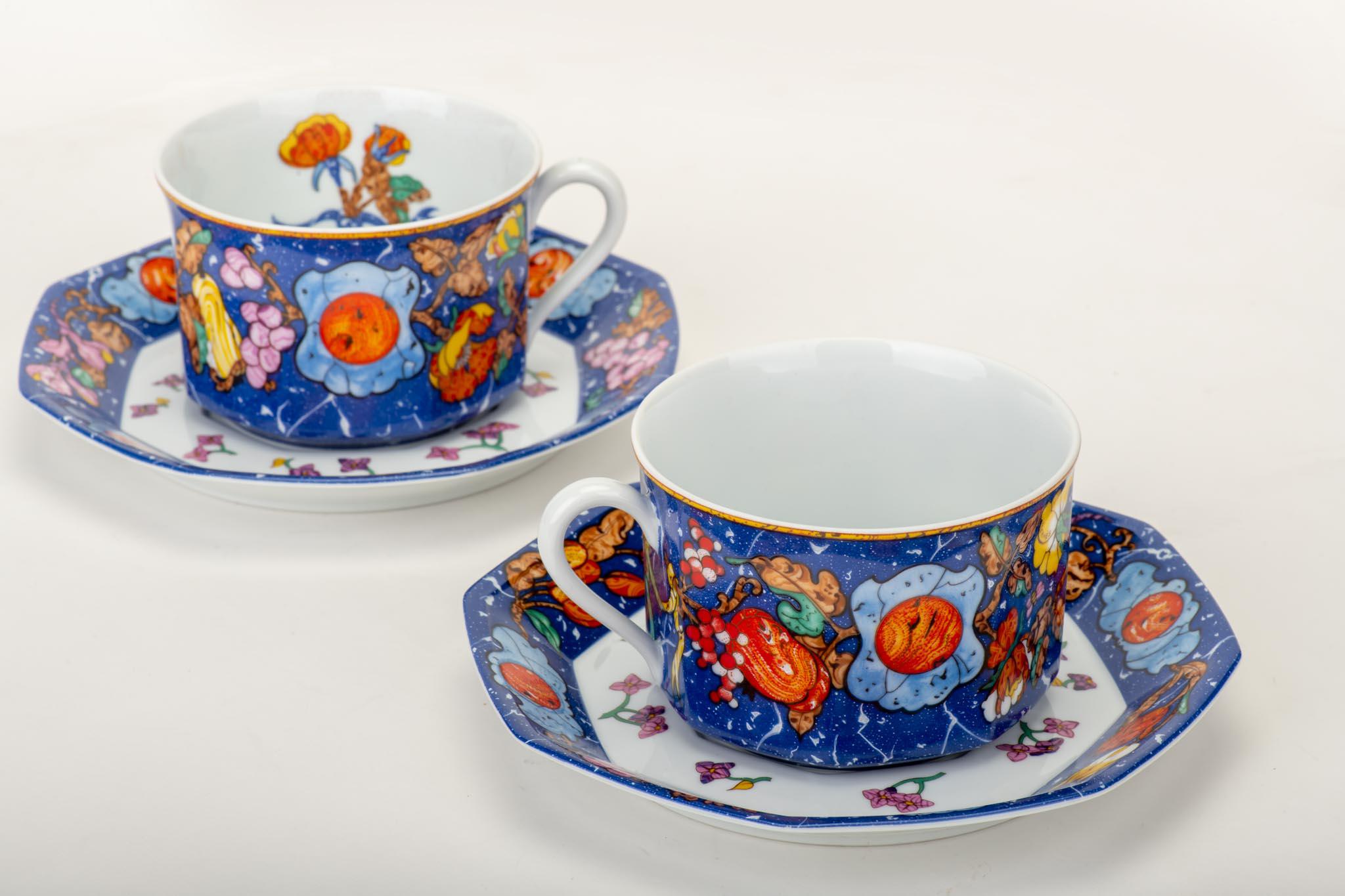 Set of two Hermès vintage teacups and saucers with an ornate design in multicolor. Come with original box.