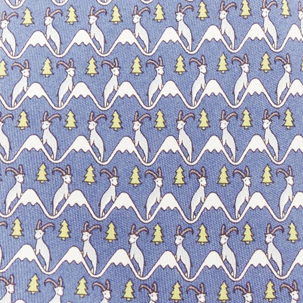 HERMES blue white green 100% silk goat mountain tree print formal tie
Reference: LACG/A00440
Brand: Hermes
Material: Silk
Color: Blue, Green
Pattern: Cartoon
Lining: Blue Silk
Made in: France

CONDITION:
Condition: Excellent, this item was pre-owned