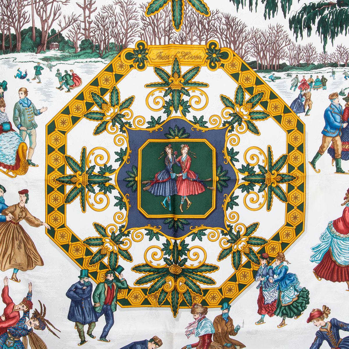 
100% authentic Hermes 'Les Joies d'Hiver 90' scarf by Joachim Metz in white silk (100%) with ice skaters jacquard. Blue border and details in gold, green, red and blue. Have been worn and are in excellent condition.

Width 90cm (35.1in)
Height 90cm