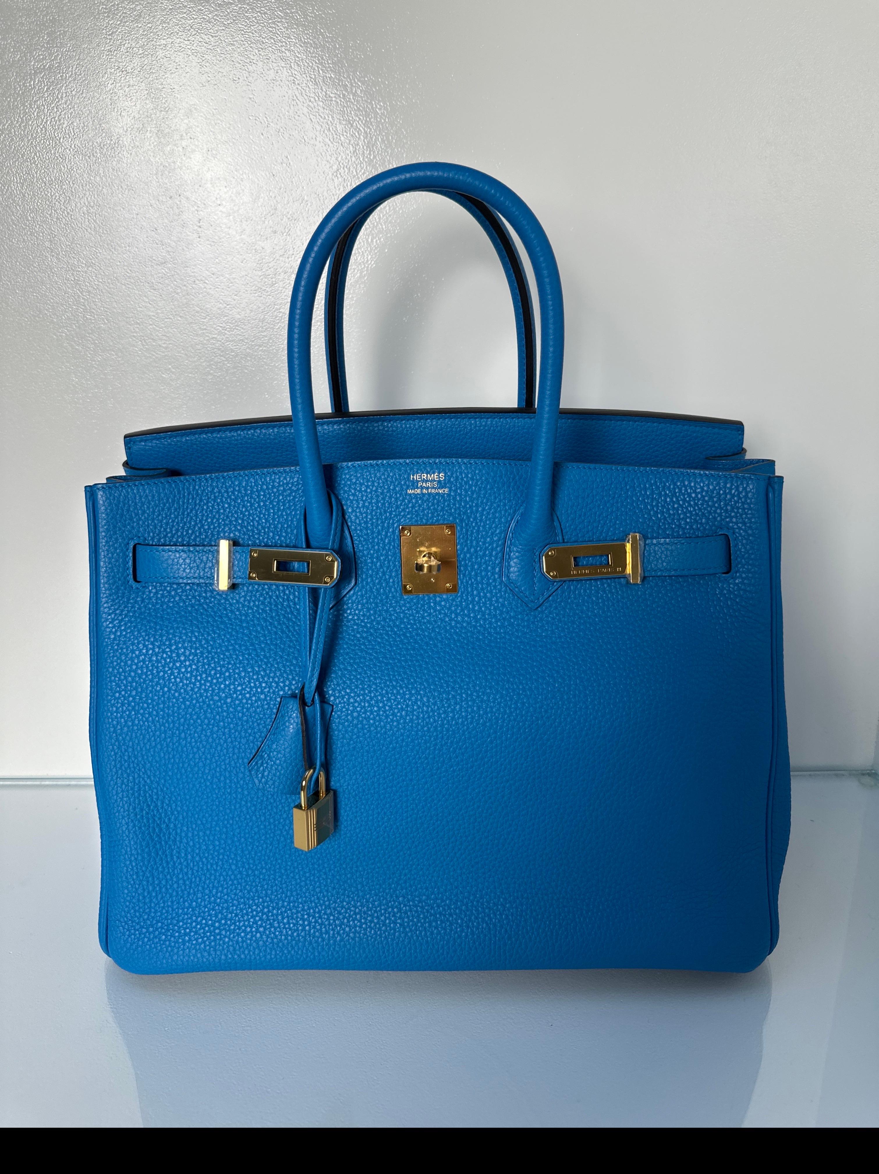 Hermes Blue Zanzibar Birkin 35 Bag. Beautiful vibrant blue color with gold hardware. Excellent condition. Plastic still on hardware. Looks like new. Interior clean. Includes clochette, lock, keys, and dust bag. Guaranteed authentic. 