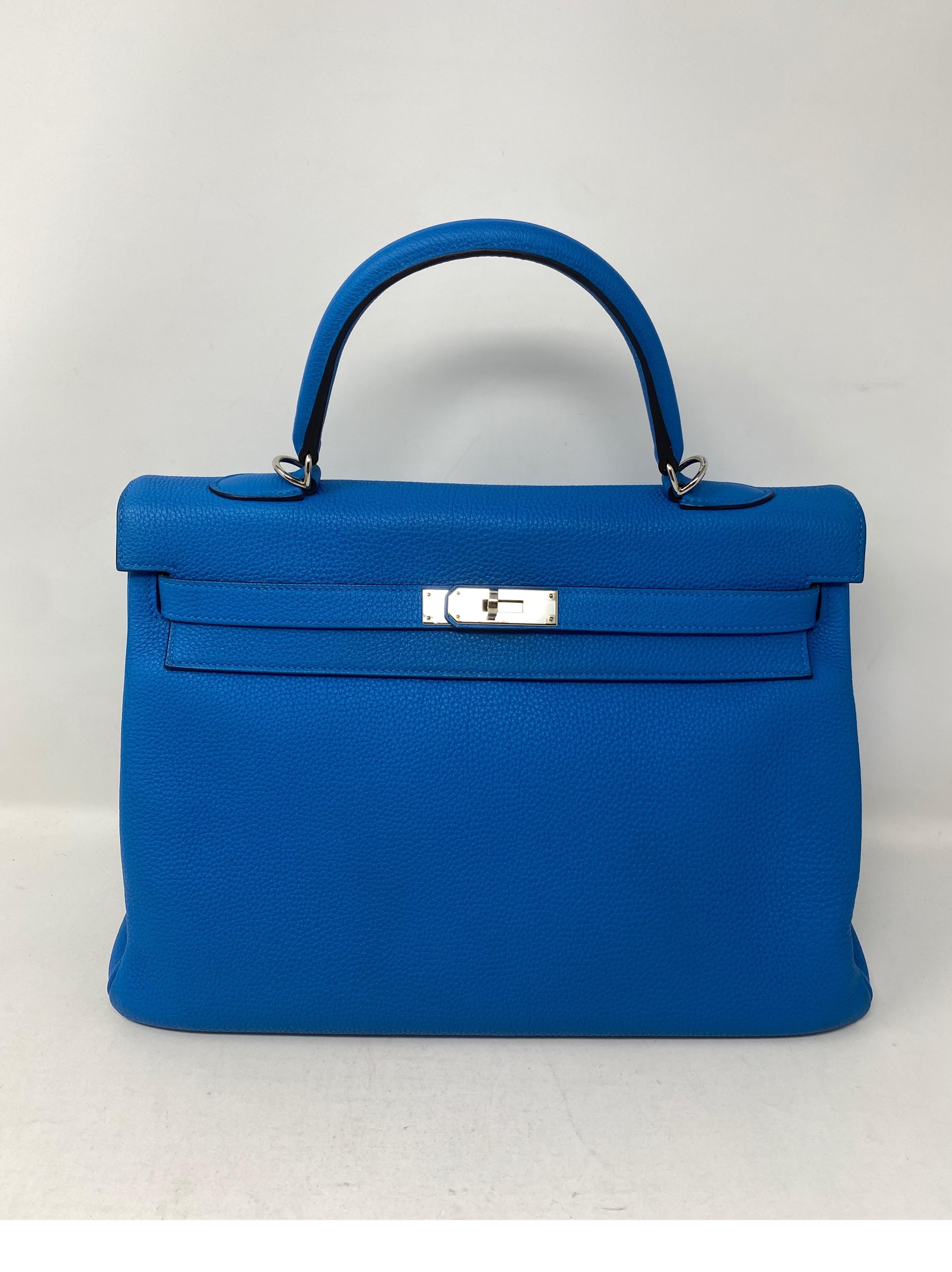 Hermes Blue Zanzibar Kelly 35 Bag. Palladium hardware. Excellent like new condition. Vibrant blue color. Togo leather. Kelly bags are classic investments. Includes clochette, lock, keys, and dust cover. Guaranteed authentic. 