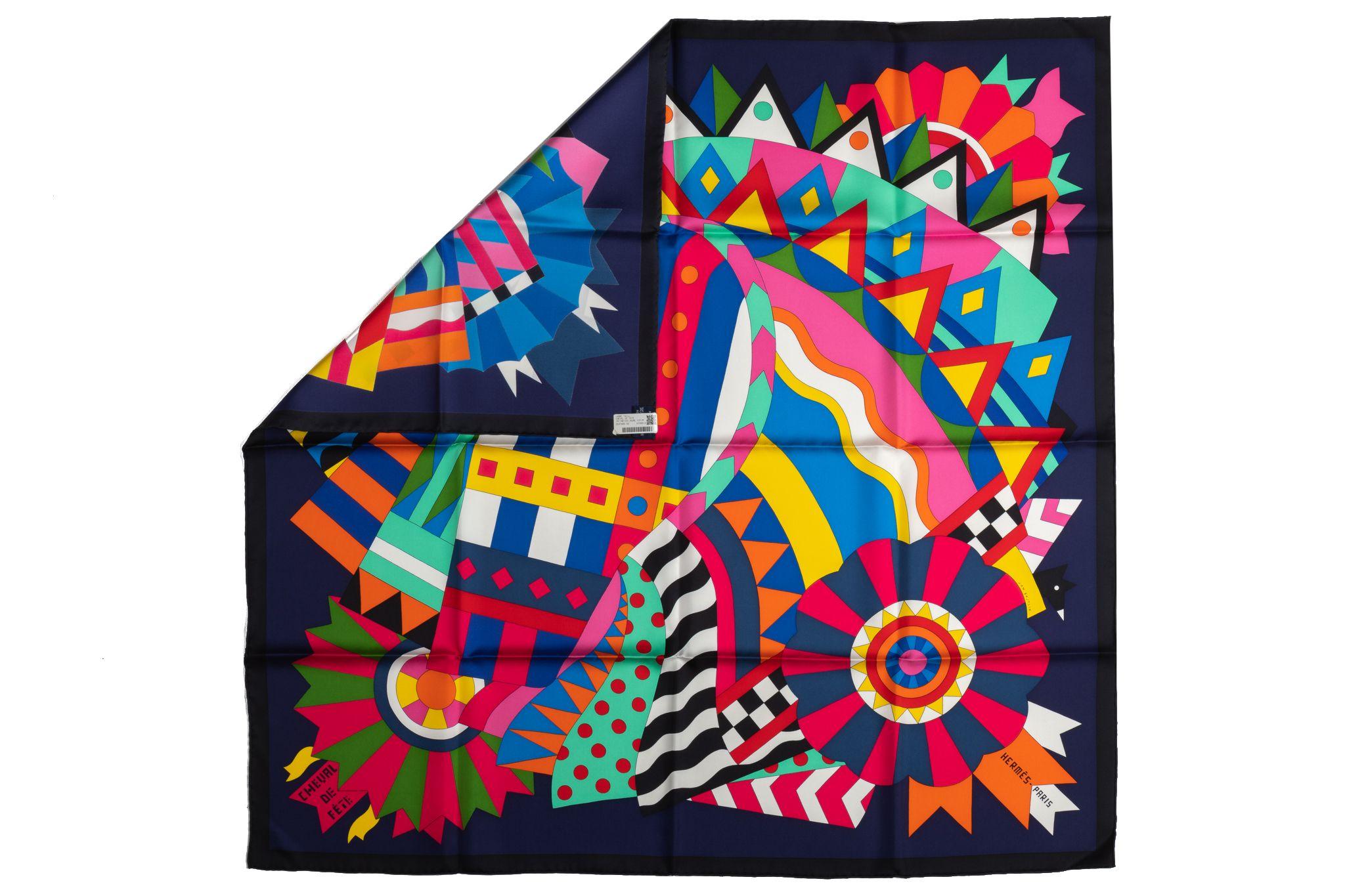 Hermès navy-and-black silk scarf with a multicolor abstract design of a horse. Hand-rolled edges. Original box included.
