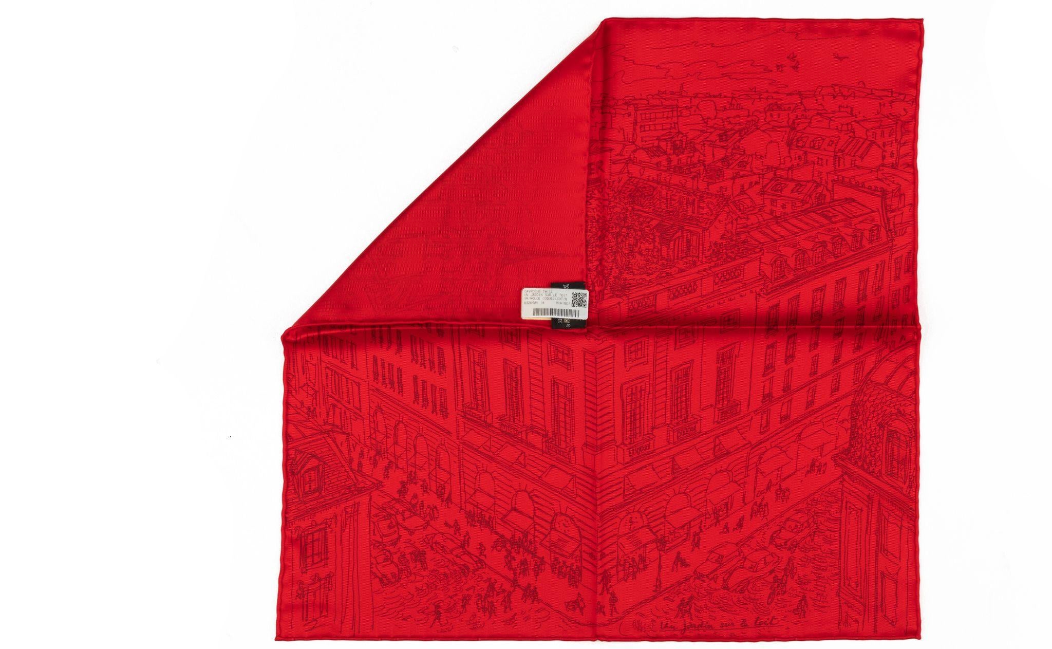 Gavroche en soie de la marque Hermès, couleur rouge, design du magasin de la rue Fouburg. Livré avec sa boîte d'origine.