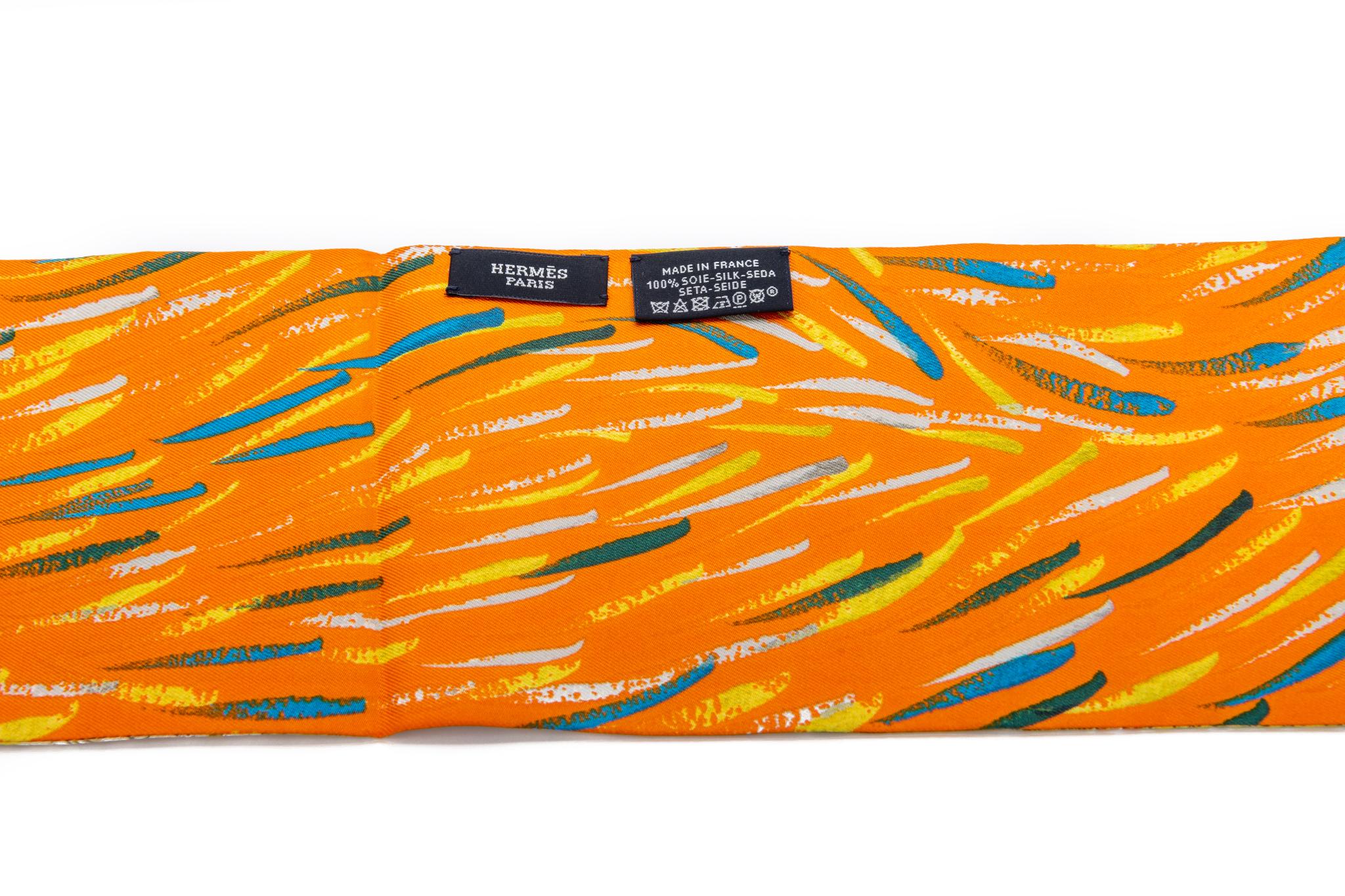 Hermès BNIB collectible Texas Wildlife silk ascot. Famous design by Kermit Oliver in orange color way. Comes with original box.