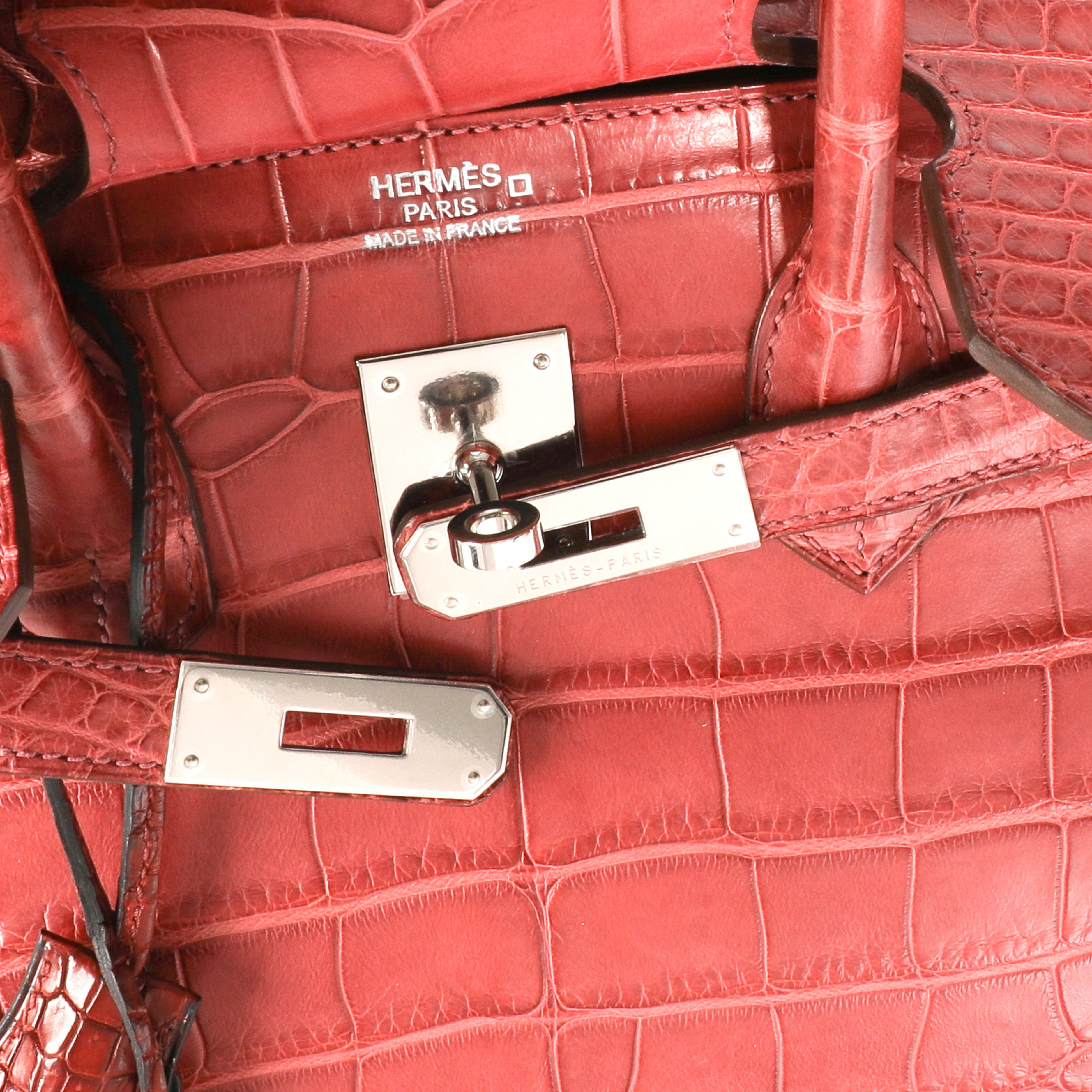 Hermès Bois De Rose Matte Alligator Birkin 35 PHW

Handbag Condition: Very Good
Condition Comments: Very Good Condition. Plastic on some hardware. Natural darkening to skin at corners and handles. Scratching to feet. Due to exotic skin, may not be