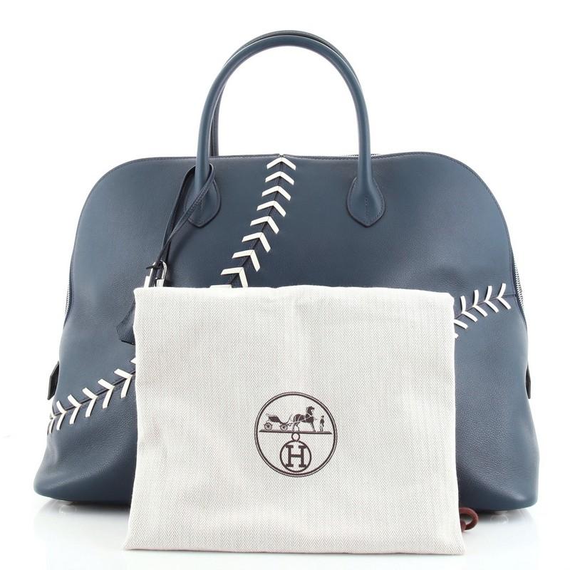 Condition: Very good. Wear on base corners, creasing, light scuffs and small indentations on exterior and interior leather trims. Moderate wear on handles, scratches on hardware.
Accessories: Clochette, Dust Bag, Keys, Lock
Measurements: Handle Drop