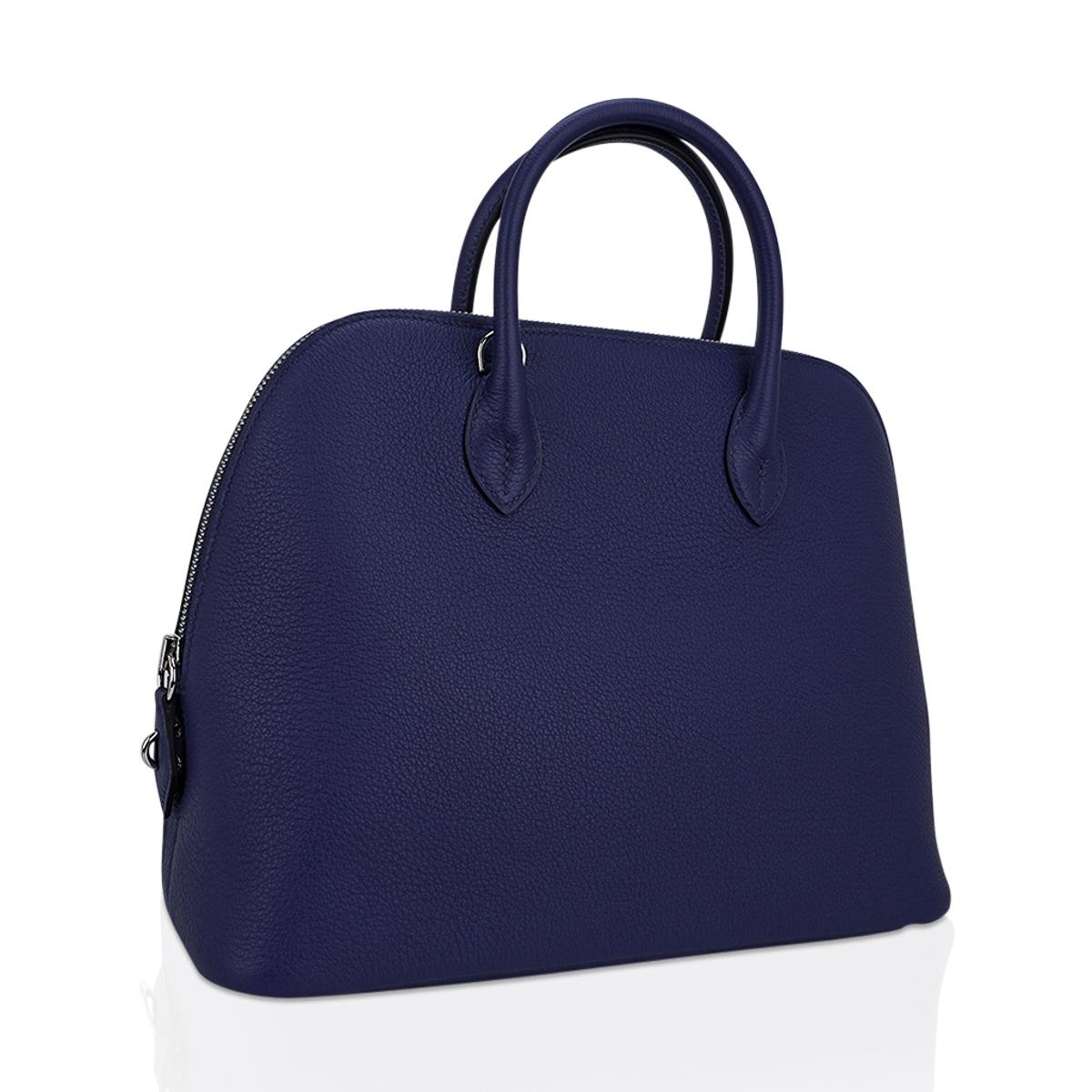 Mightychic offers an Hermes Bolide 30 1923 sleek, clean and modern and easy to fall in love with bag.
Blue Sapphire with crisp palladium hardware sets this beauty apart.
Taurillon Novillo leather has stepped to the forefront for good reason.
Bull